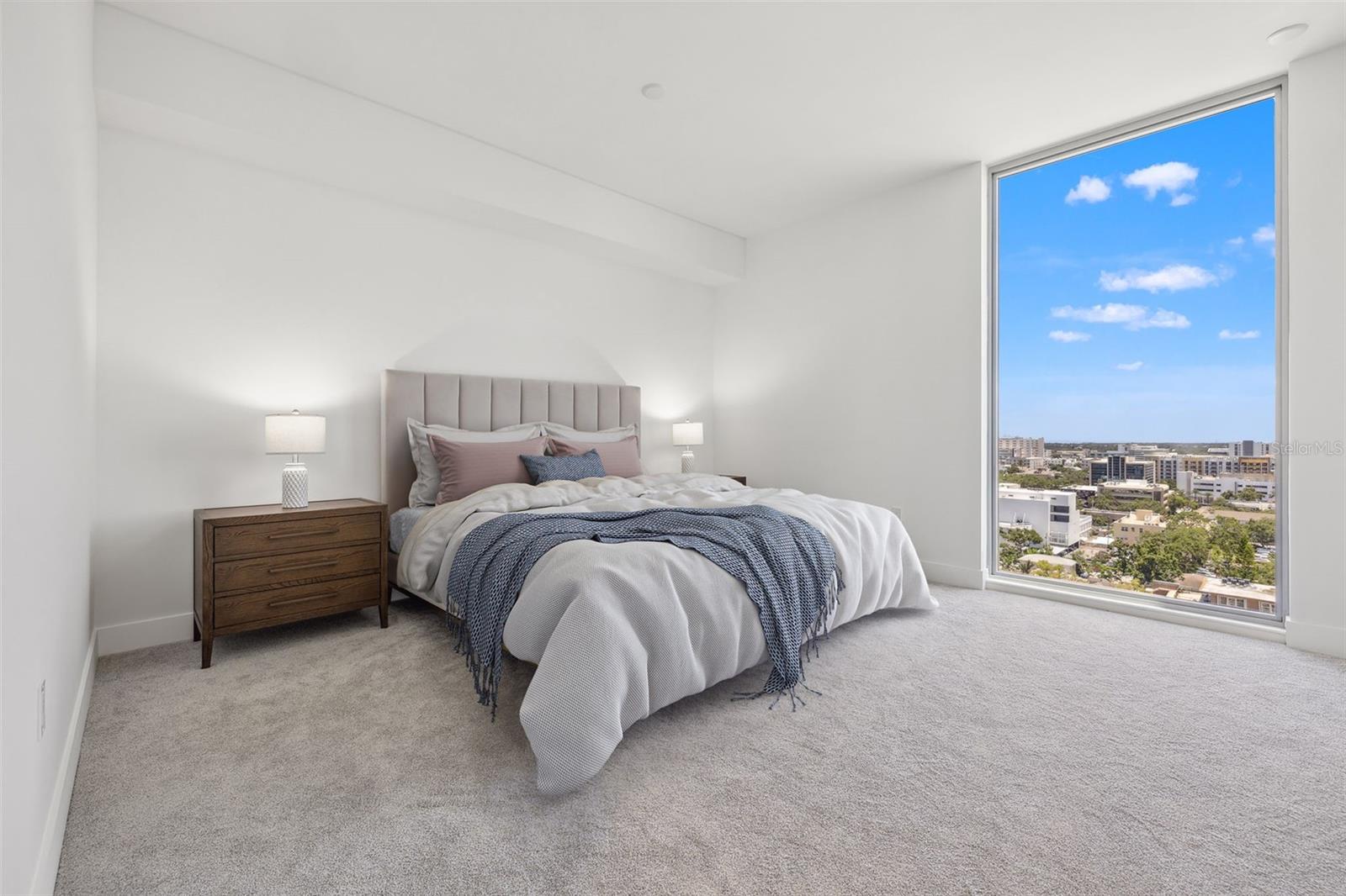 Large master bedroom with floor to ceiling window