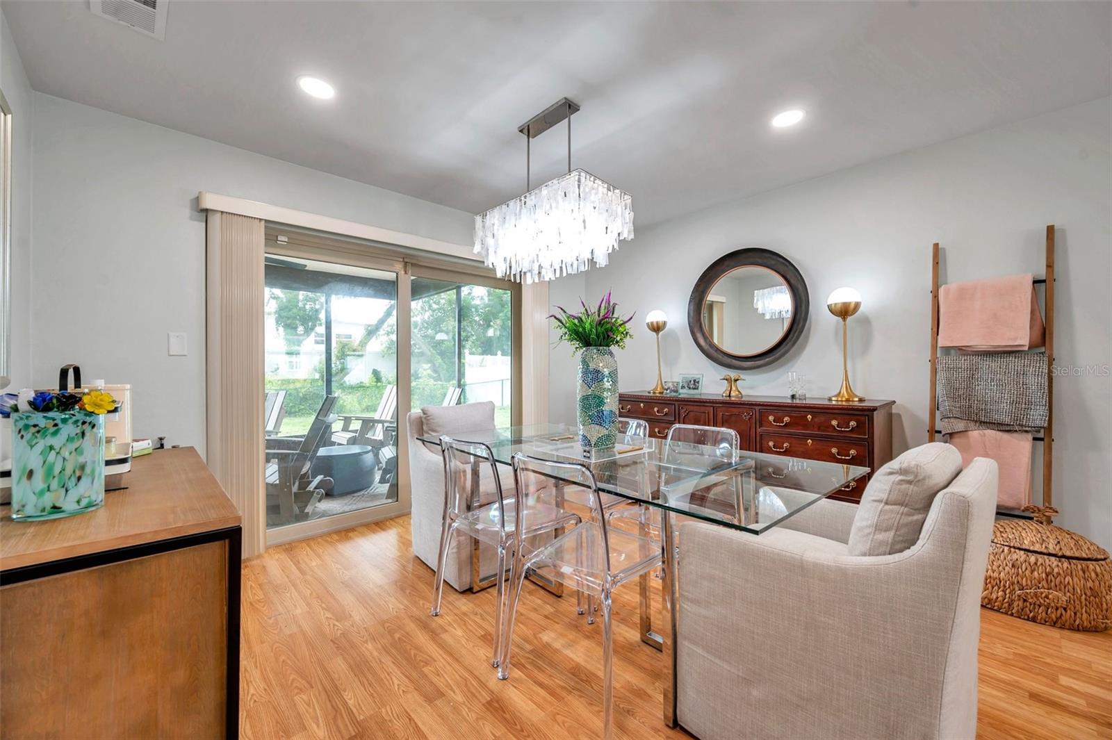 Dining room with sliders leading to screened back porch.