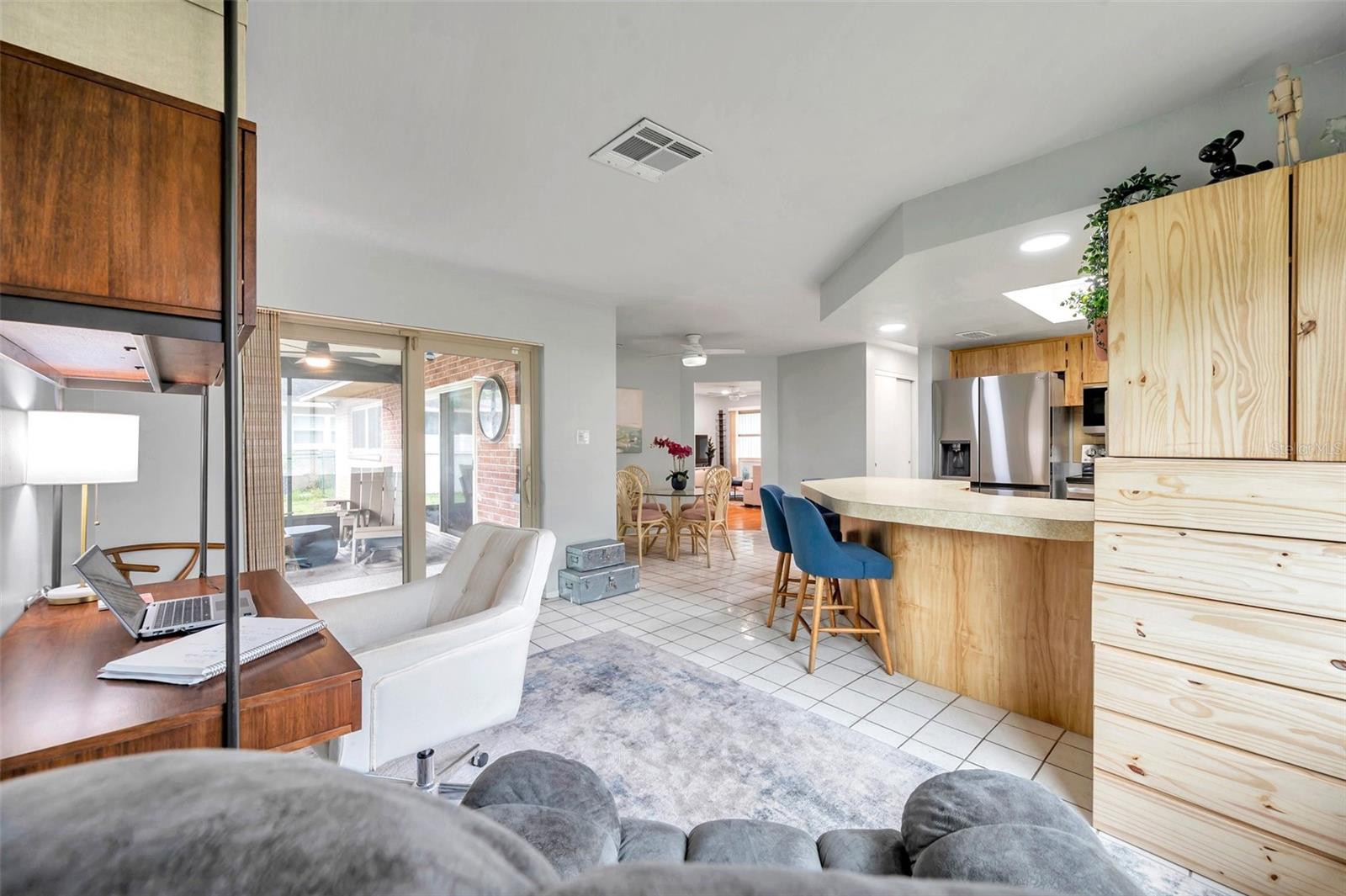 Family room, kitchen and sliders to screened in porch