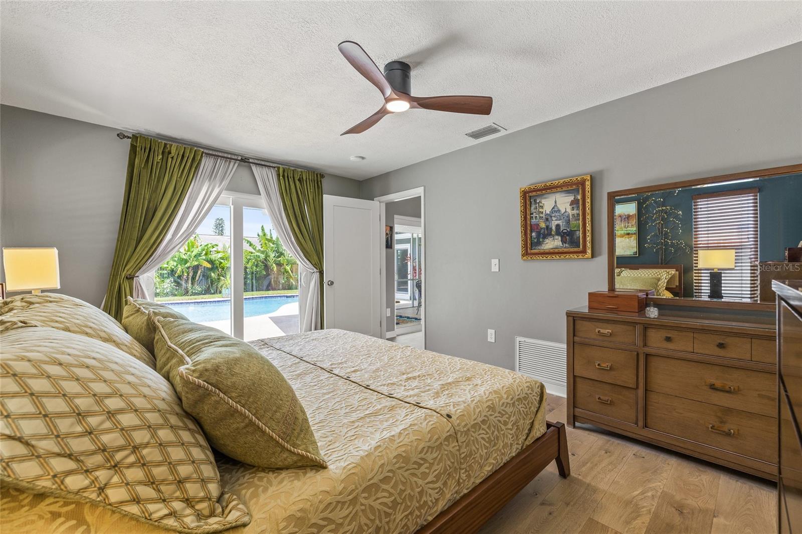 Primary Bedroom with direct access to pool area