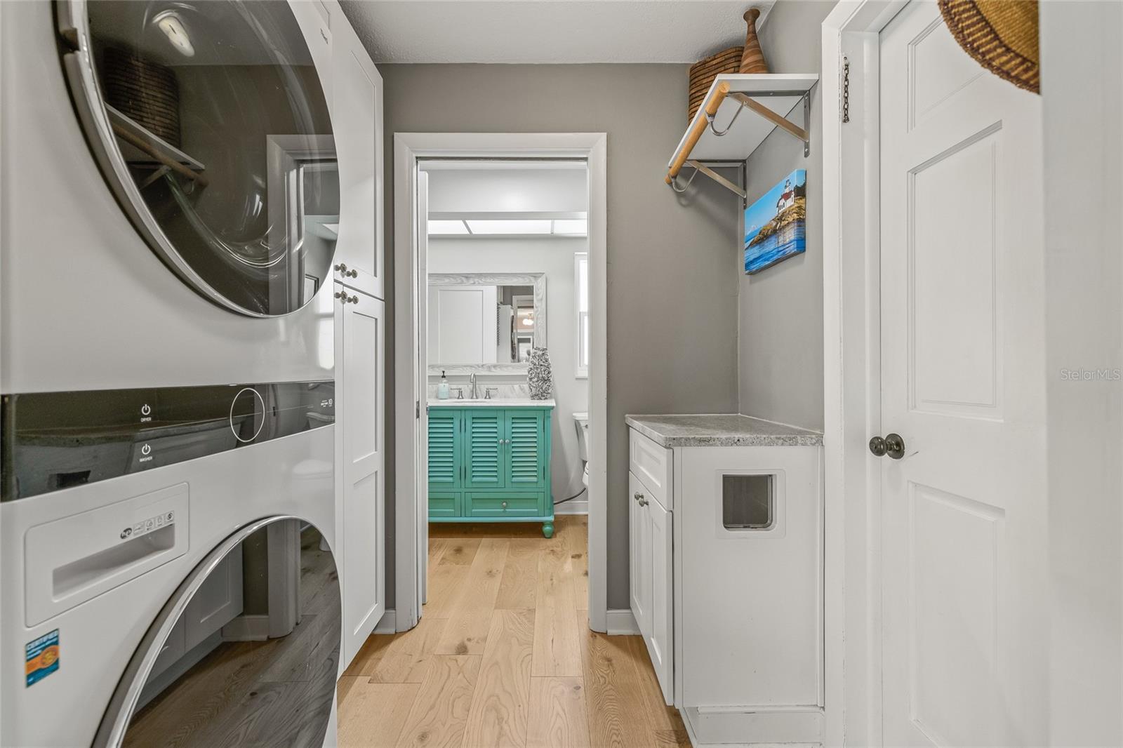 Stack Washer Dryer allows lots of storage in Laundry Room