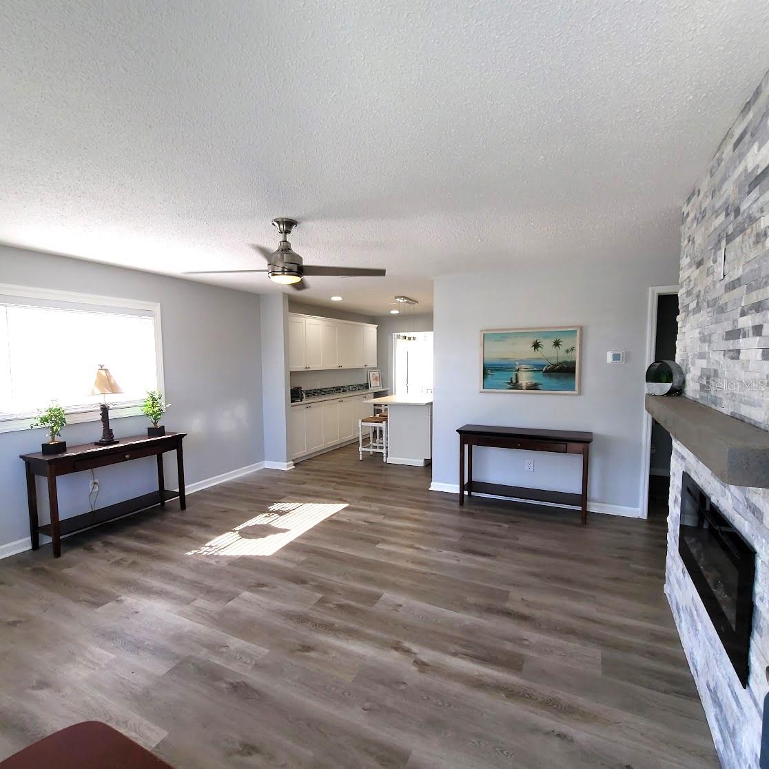 Step into the 14X15 living Room. Notice the kitchen straight ahead and the fireplace wall on the right.