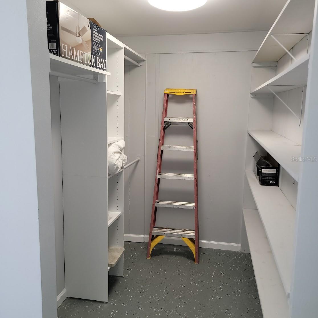 Behind the wall where you just saw the futon is this air conditioned storage area / closet.