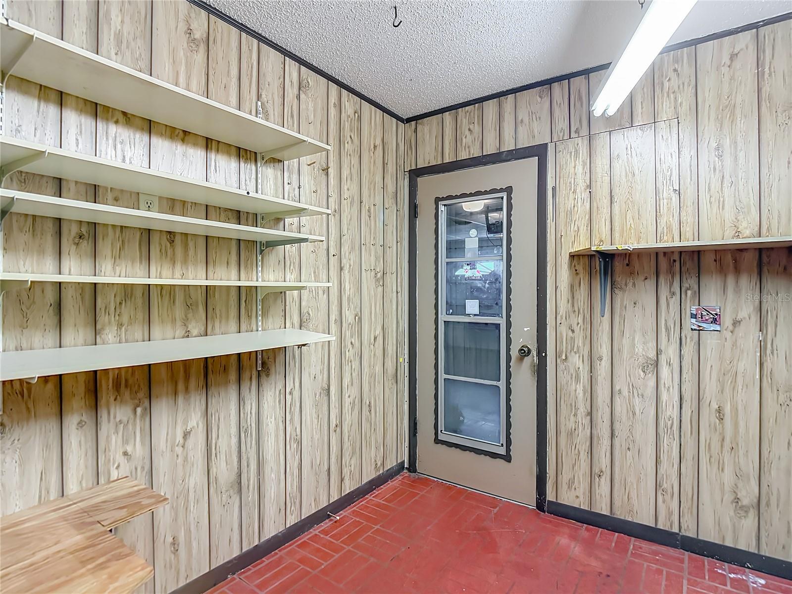 entrance from garage with workspace