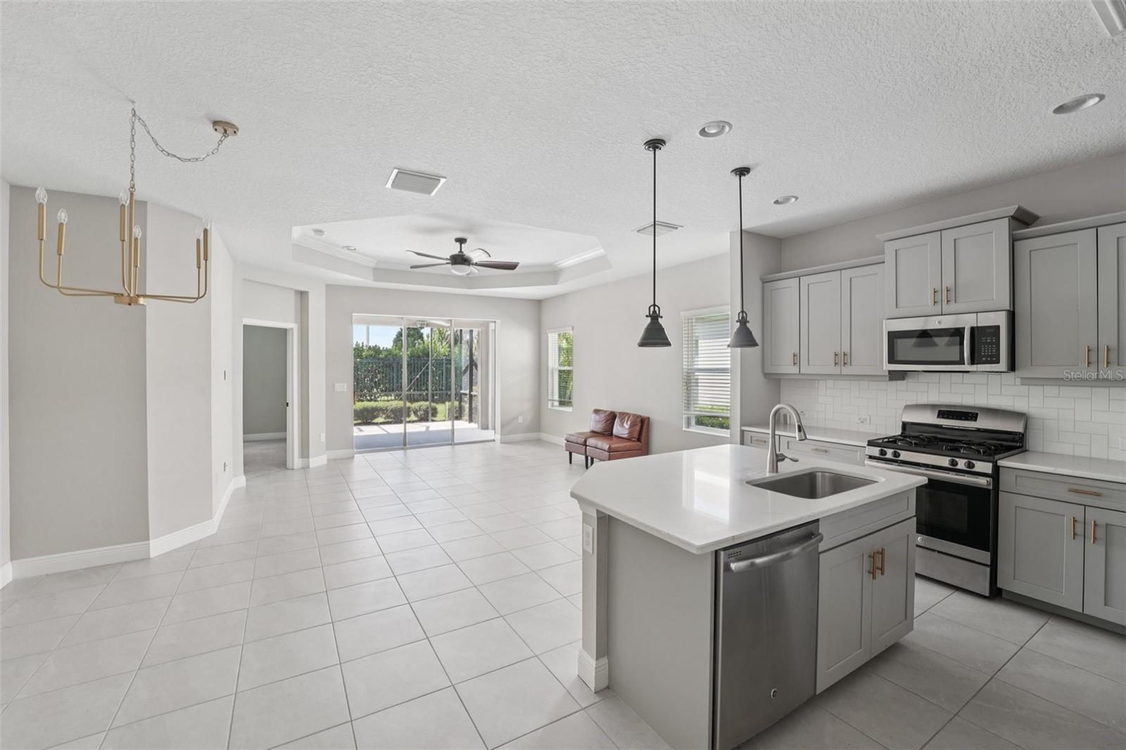 THE FAMILY CHEF WILL LOVE THE BEAUTIFUL KITCHEN WITH 5 BURNER GAS STOVE AND THE ROOMY ISLAND