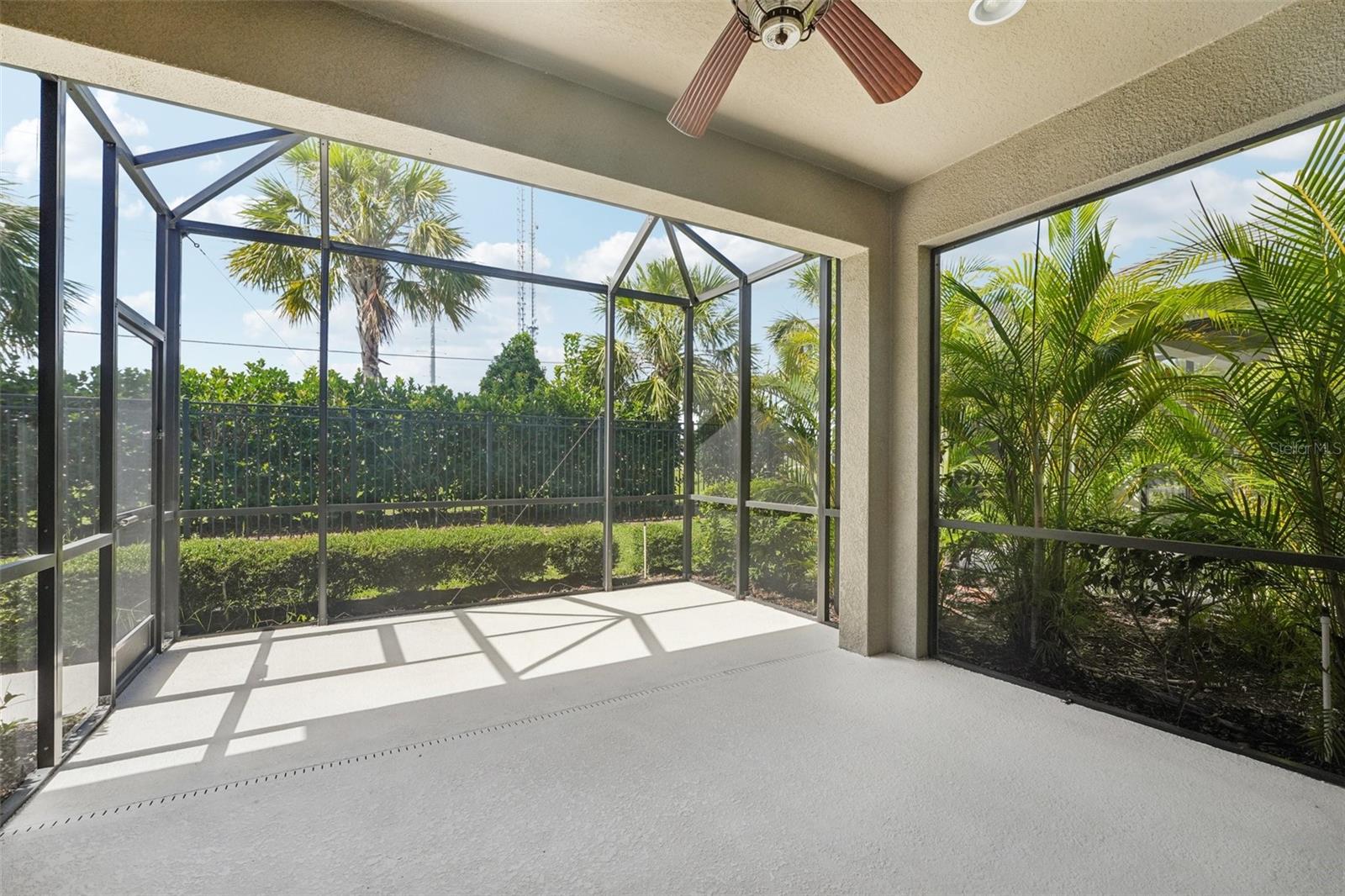 COVERED SCREEN LANAI PROVIDES OUTSIDE ENTERTAINMENT SPACE