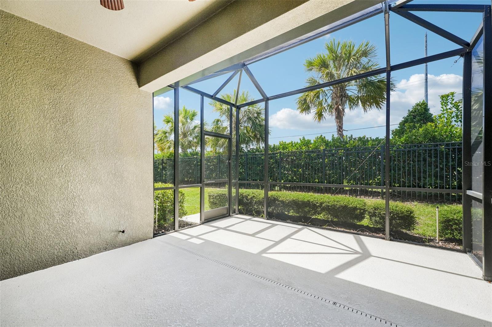 COVERED SCREEN LANAI PROVIDES OUTSIDE ENTERTAINMENT SPACE