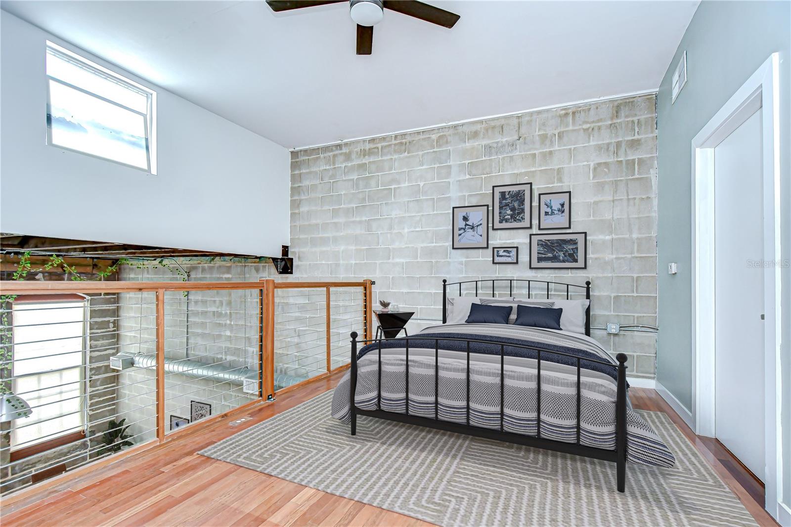 Upstairs, the open loft-style bedroom comes with hardwood floors, private en-suite, and HUGE walk-in closet!