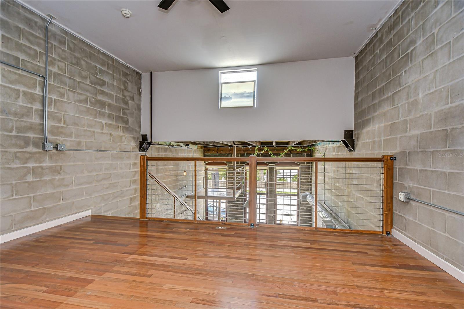 The bedroom overlooks the living area while maintaining a sense of privacy and retreat!