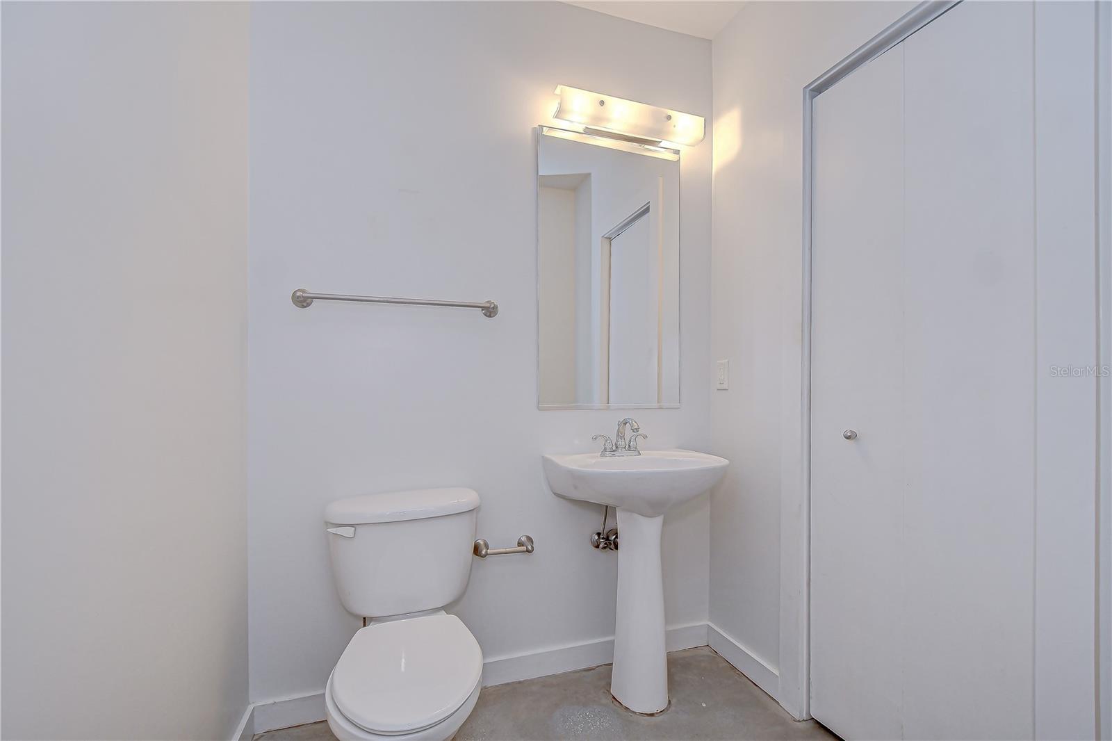 A convenient half-bath on the main level is ideal for guests.