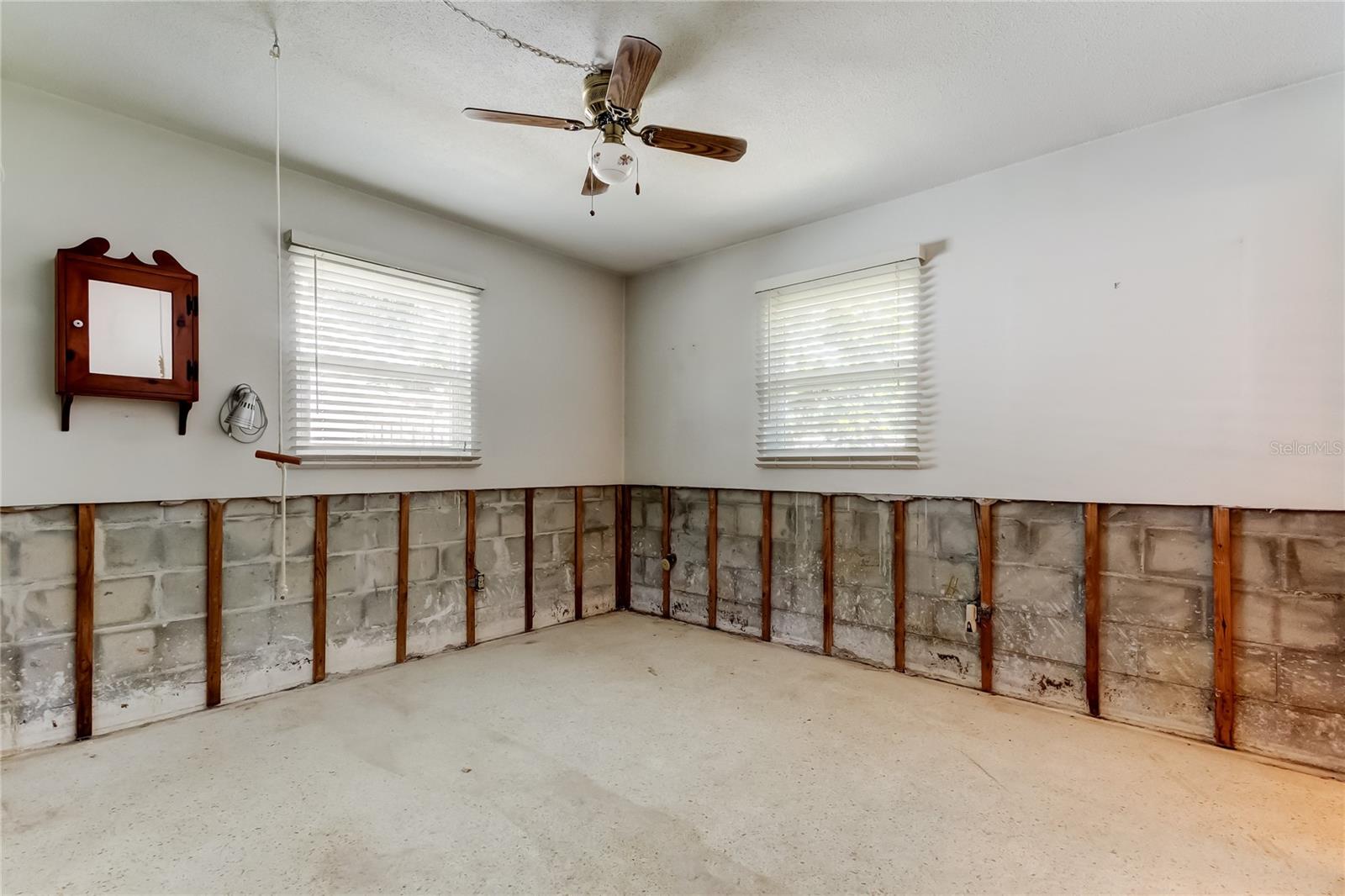Primary Bedroom with two Hurricane impact windows