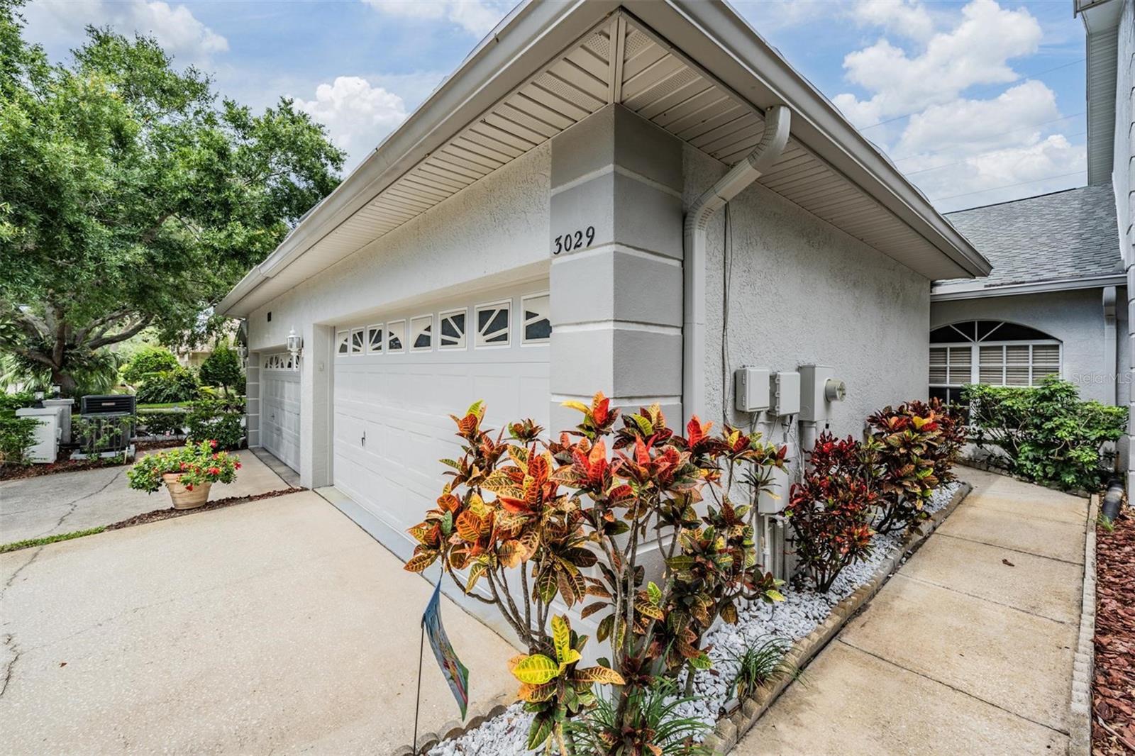 Welcome home! Private entry walk with beautiful landscaping to your front door at 3029 Brookfield Lane.