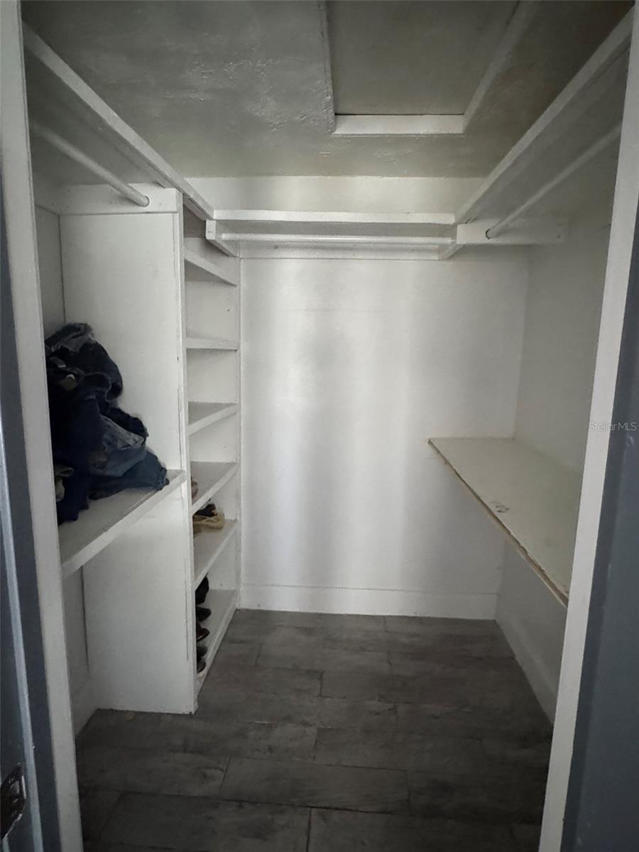 Primary bedroom walk-in closet