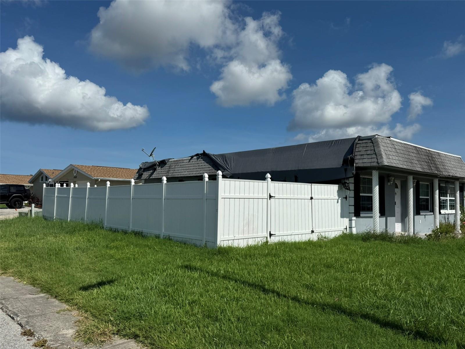 corner lot, double gates by side yard