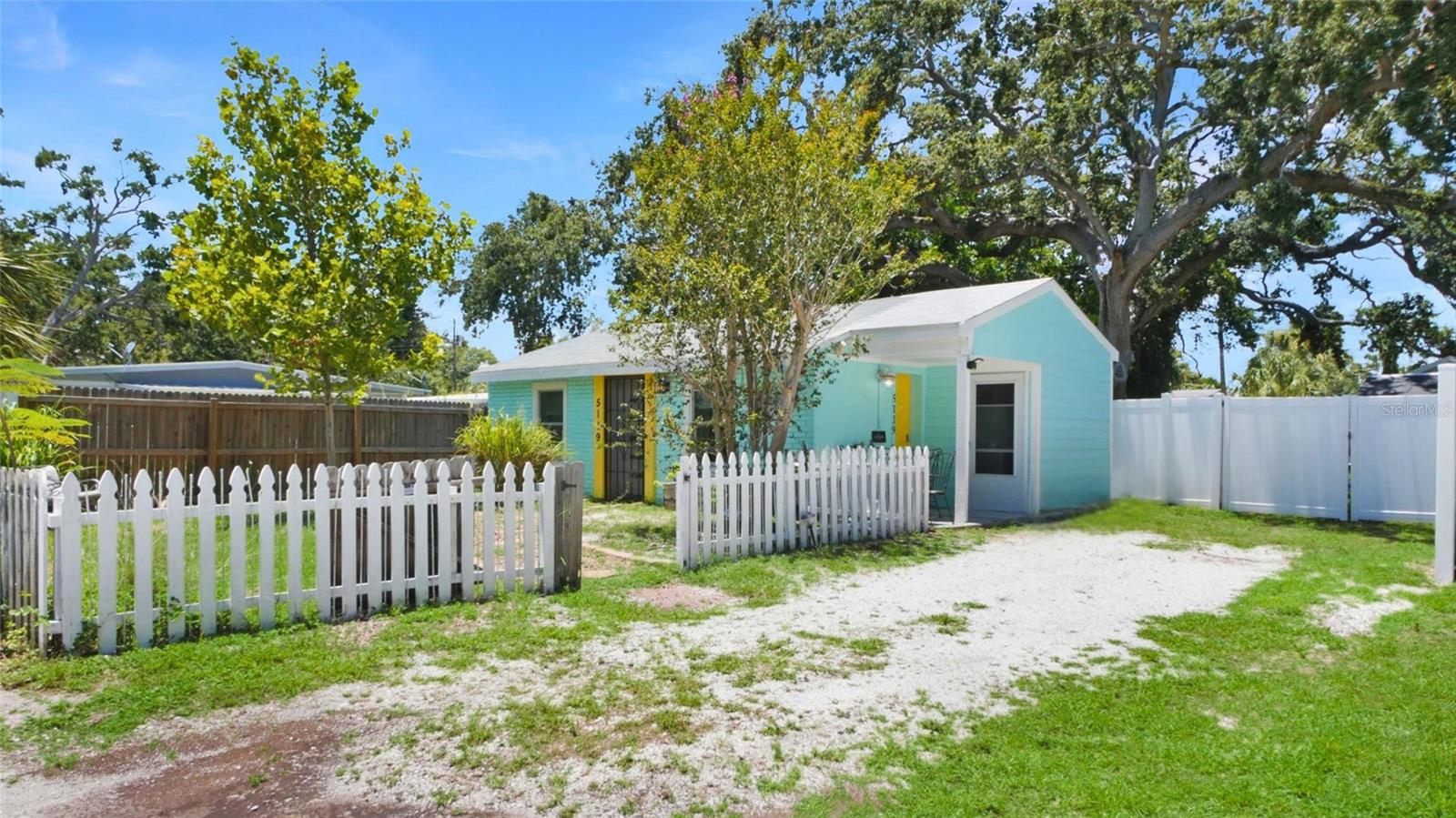 Driveway with plenty of parking and access to back yard.