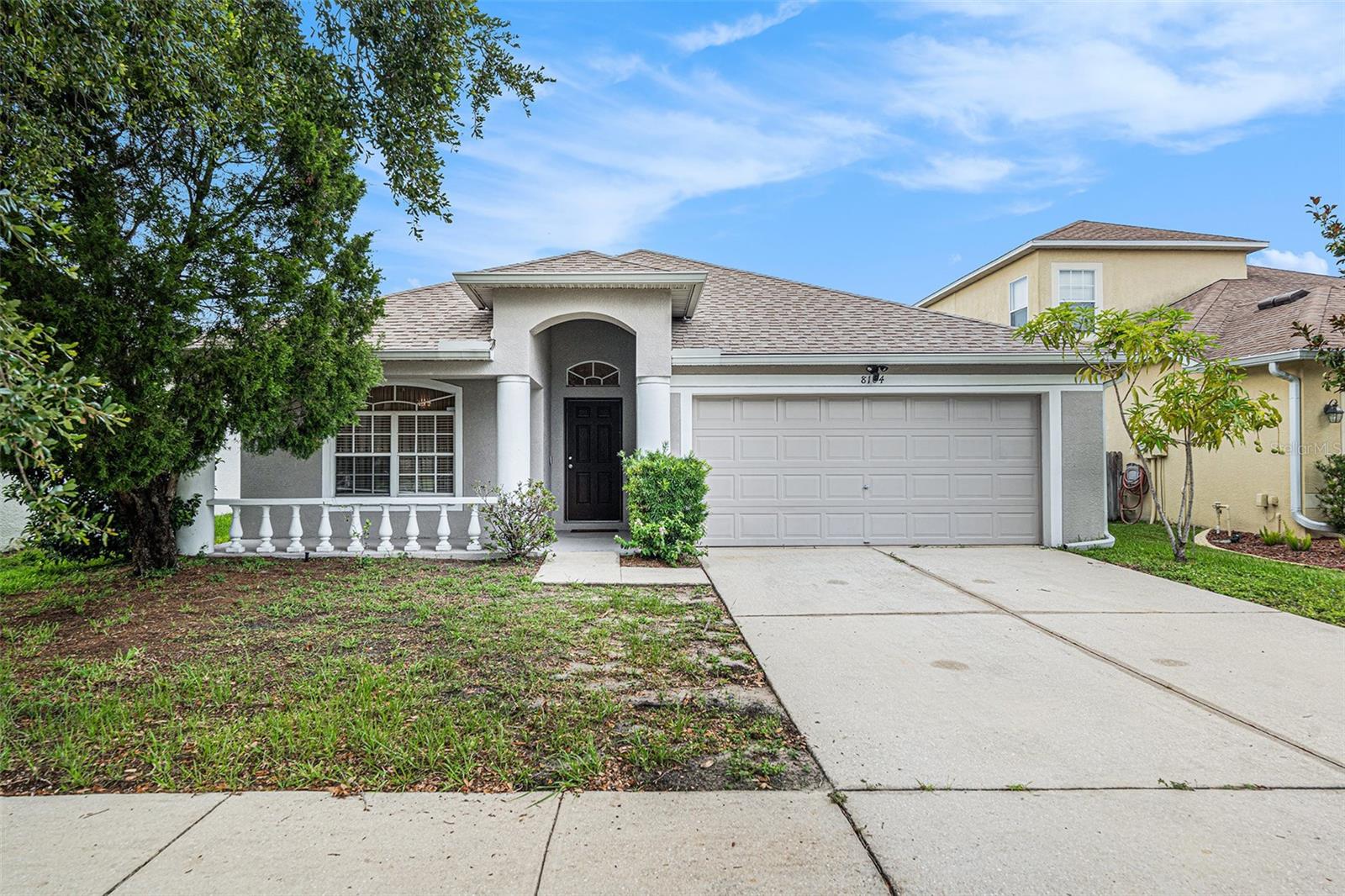Front of property, featuring a porch, 2 car garage