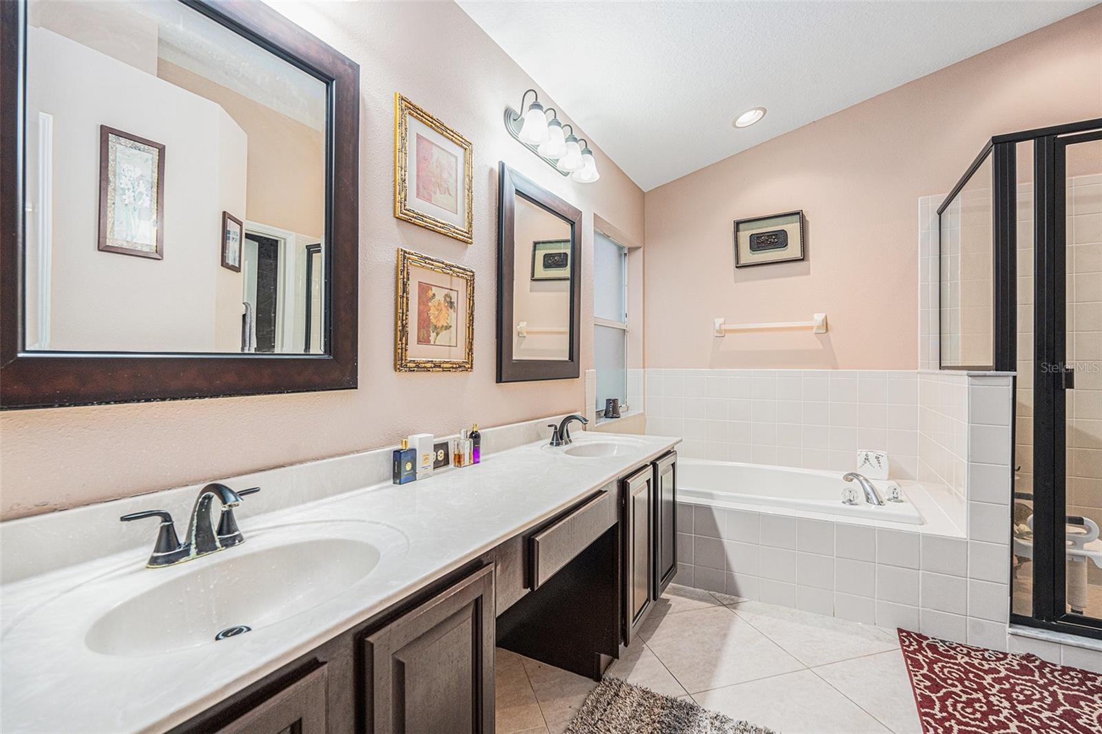 Primary en suite - dual sink, separate tub & Shower & water private closet