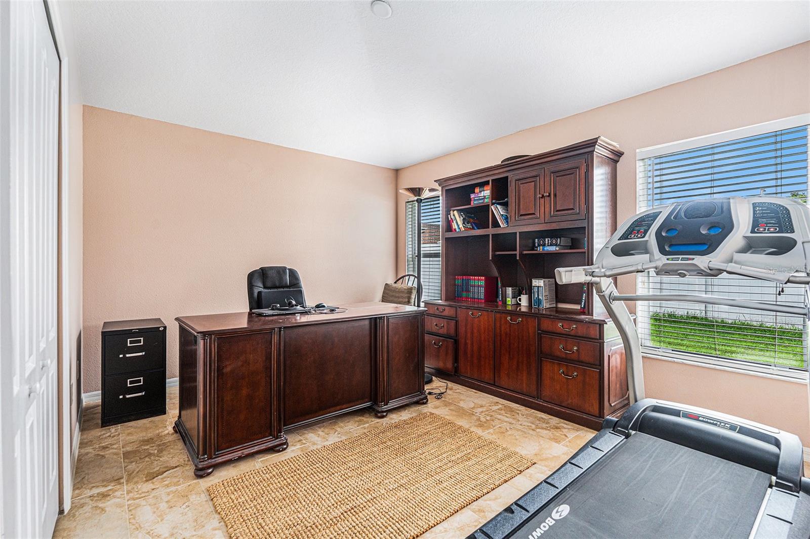 Backyard facing bedroom with built in closet