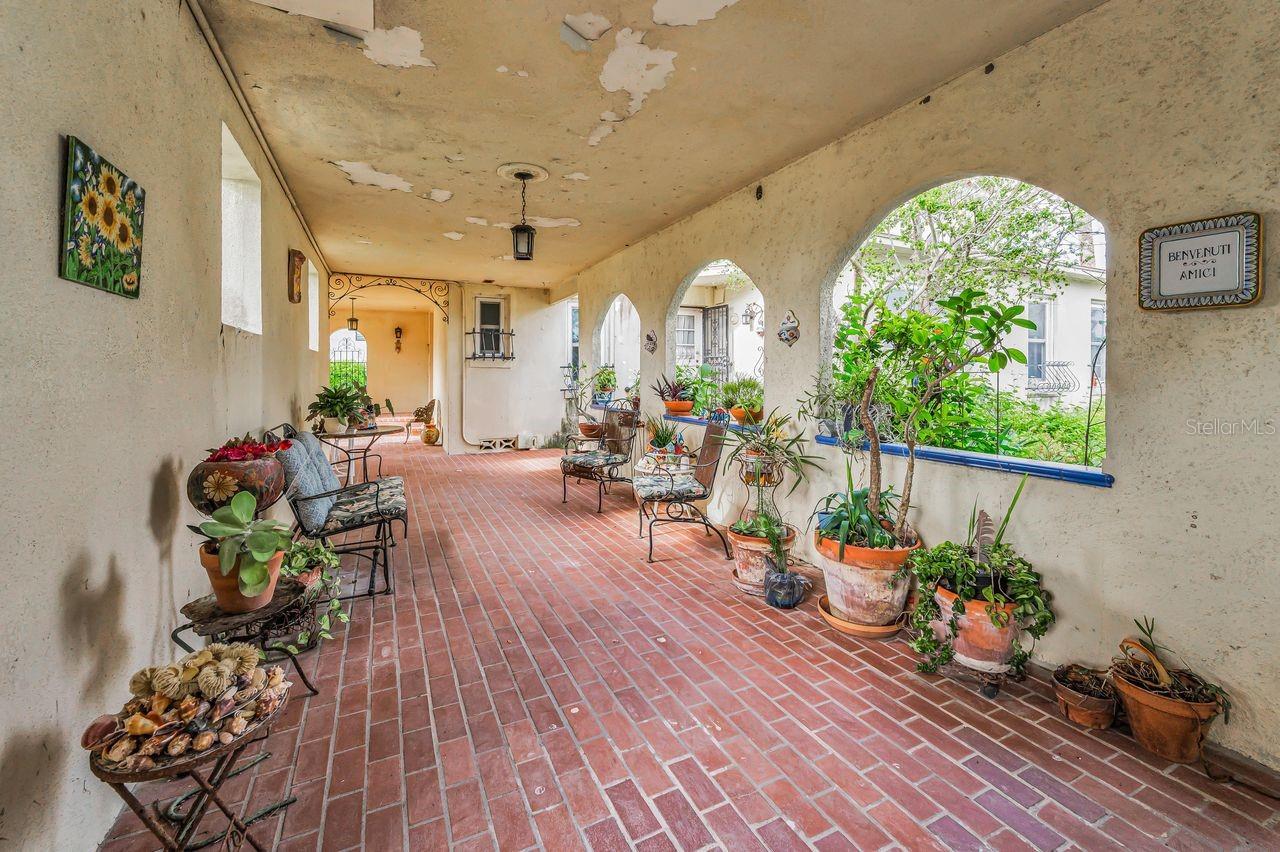 Spacious and welcoming courtyard looking towards front door (through archway)