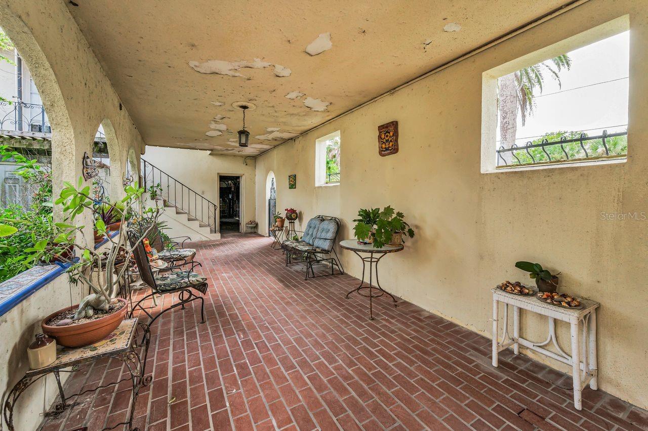 Courtyard looking towards 3 car garage and guest suite just up the stairs