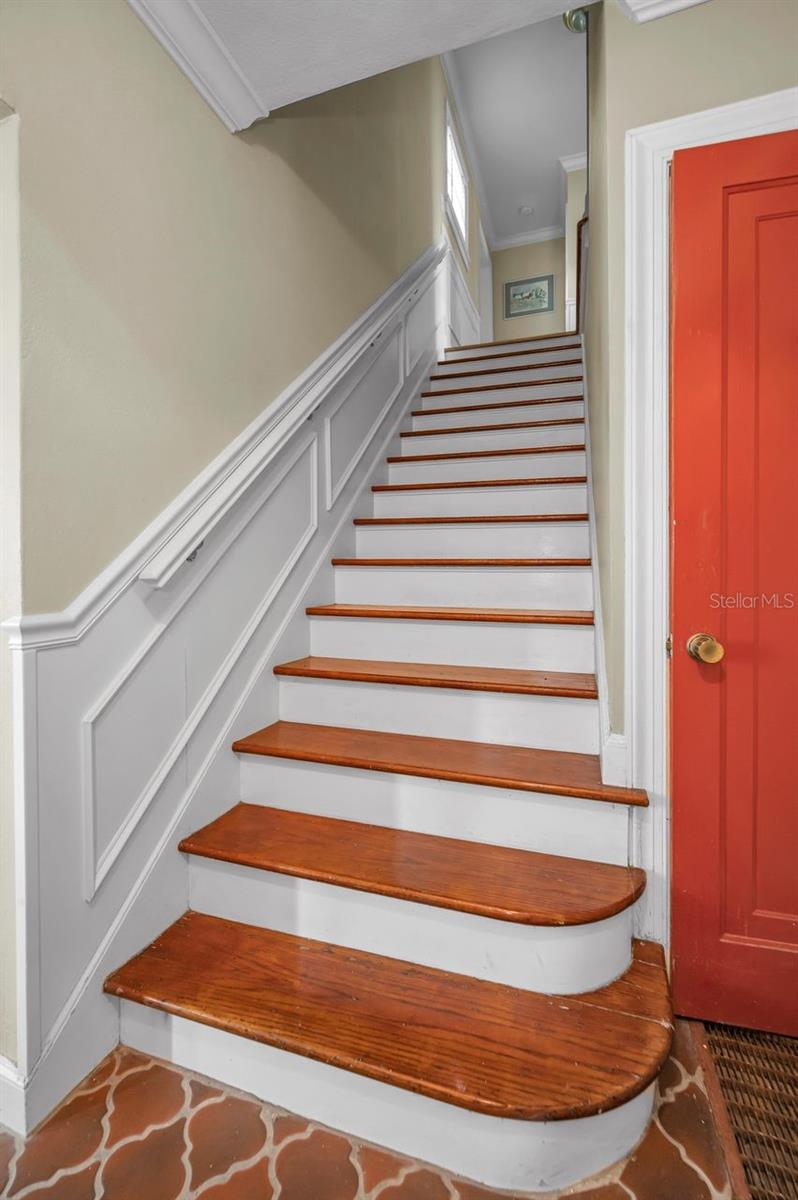 Looking up the stairs to second floor living space.