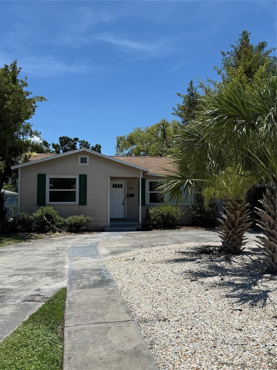Front of House. Wrap around Driveway