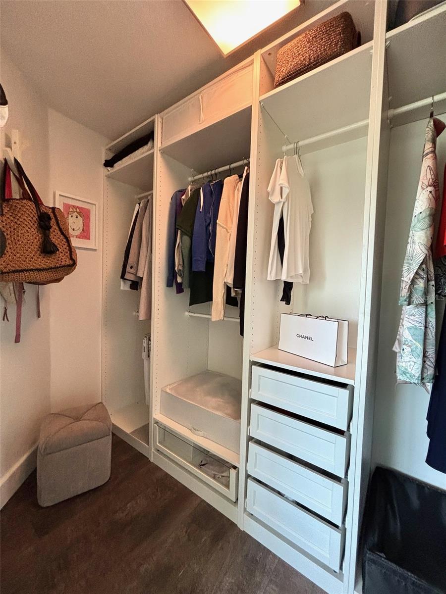 Primary bedroom walk-in closet