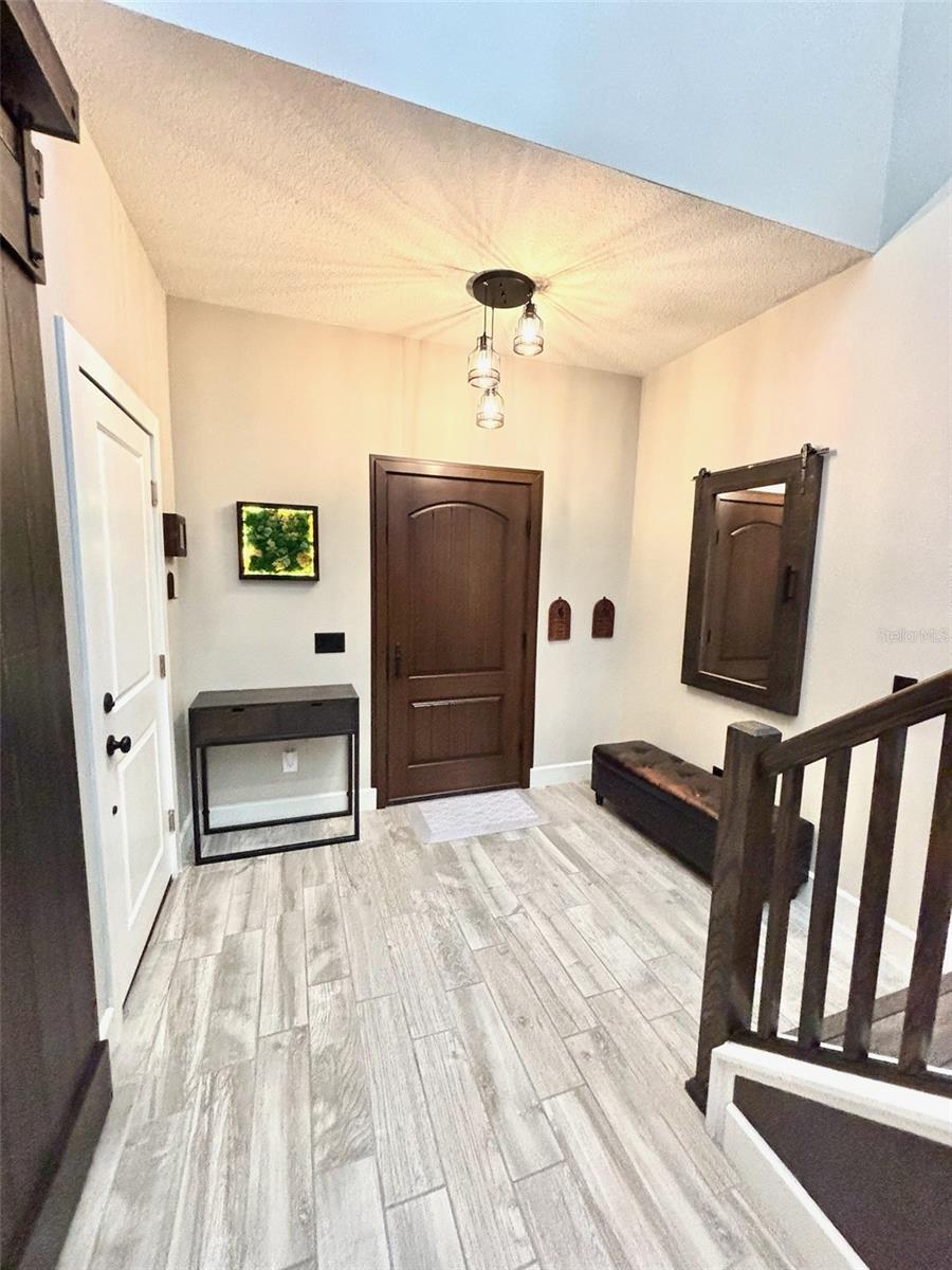 Front door w/ garage entry on left