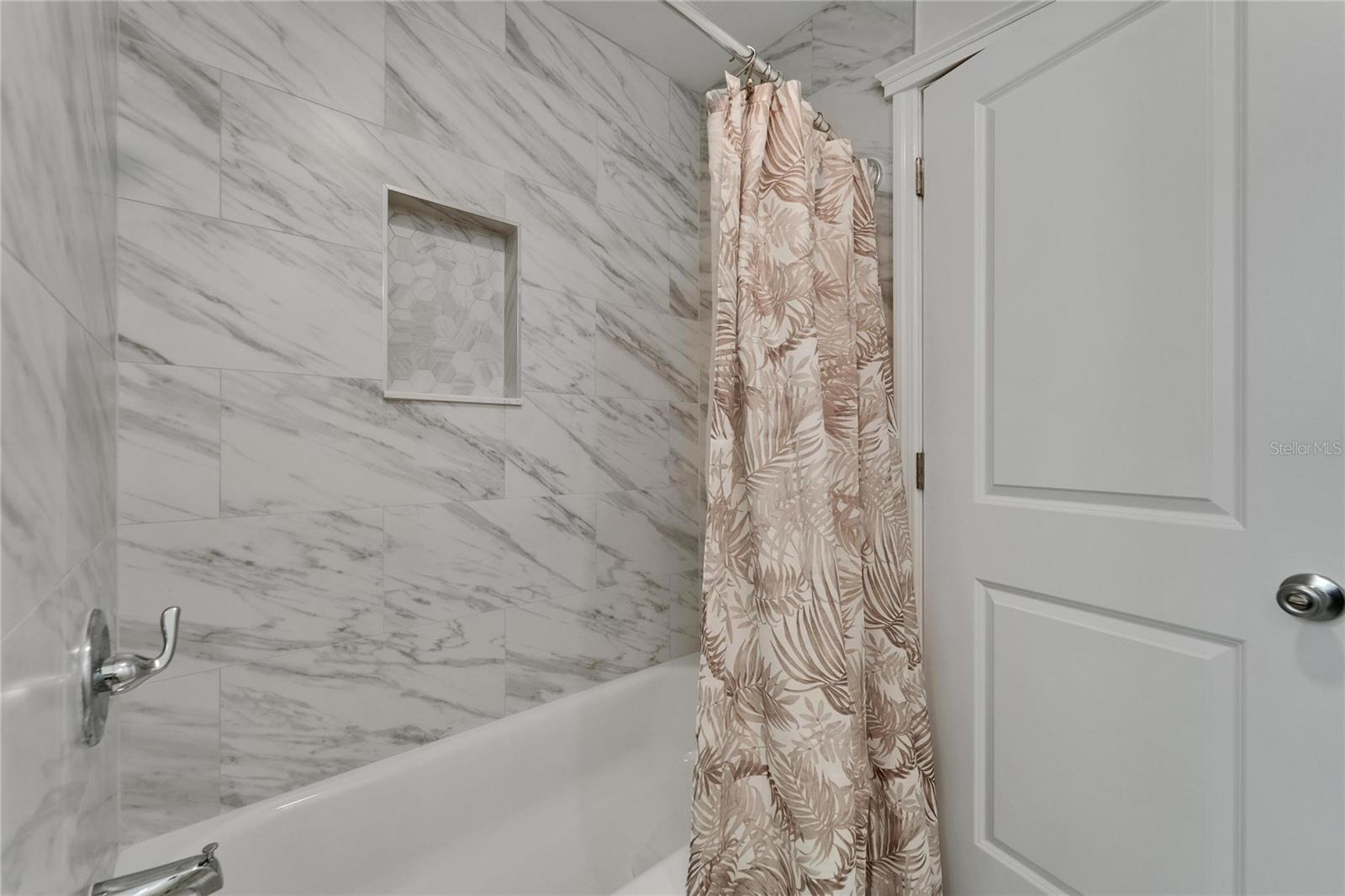 Hall bath- new tile &  tub!