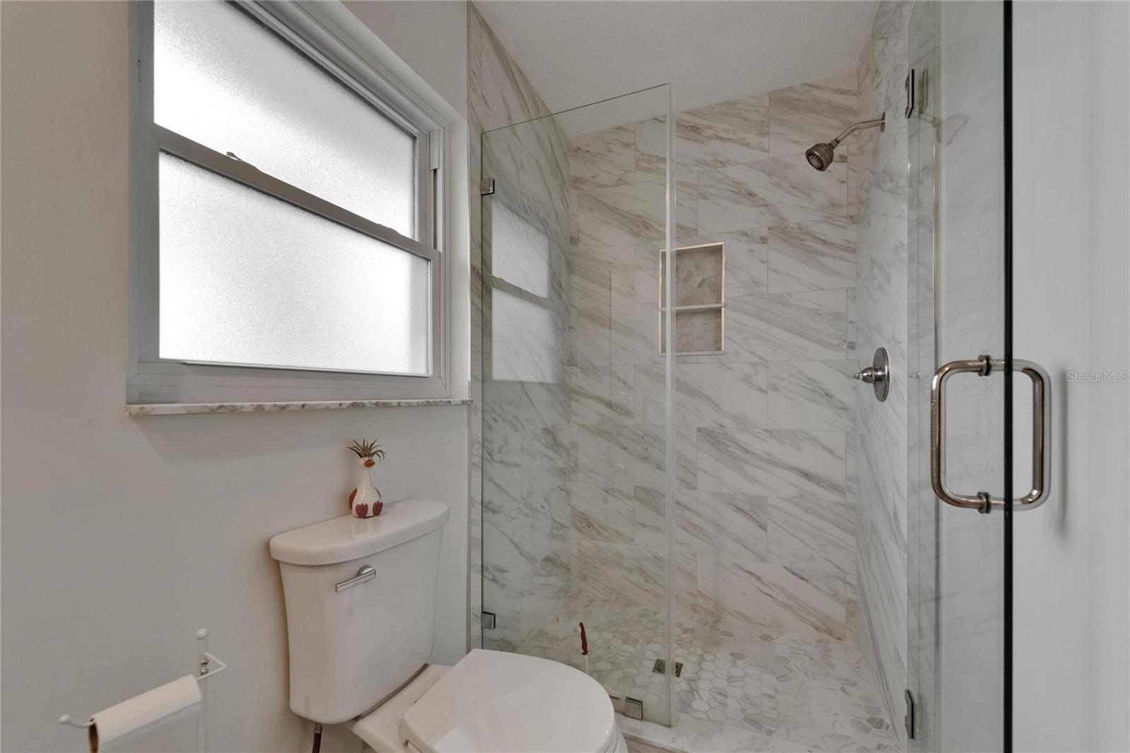 Completely New Shower,tile, door & commode
