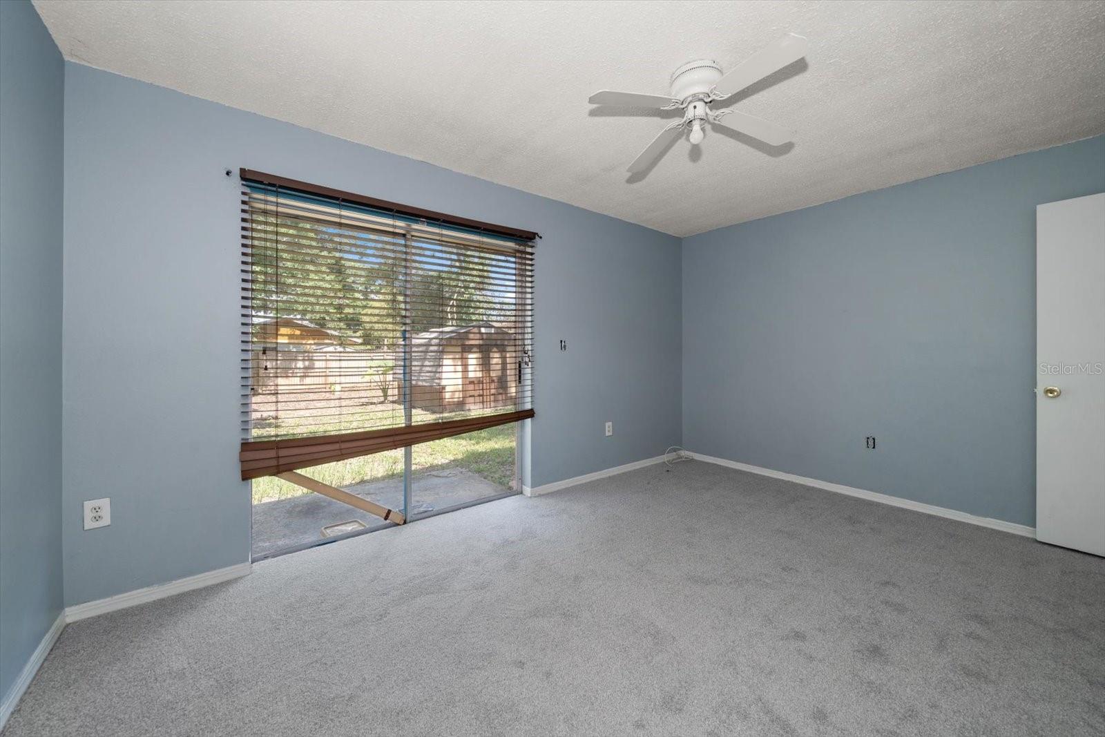 Primary bedroom with private backyard access