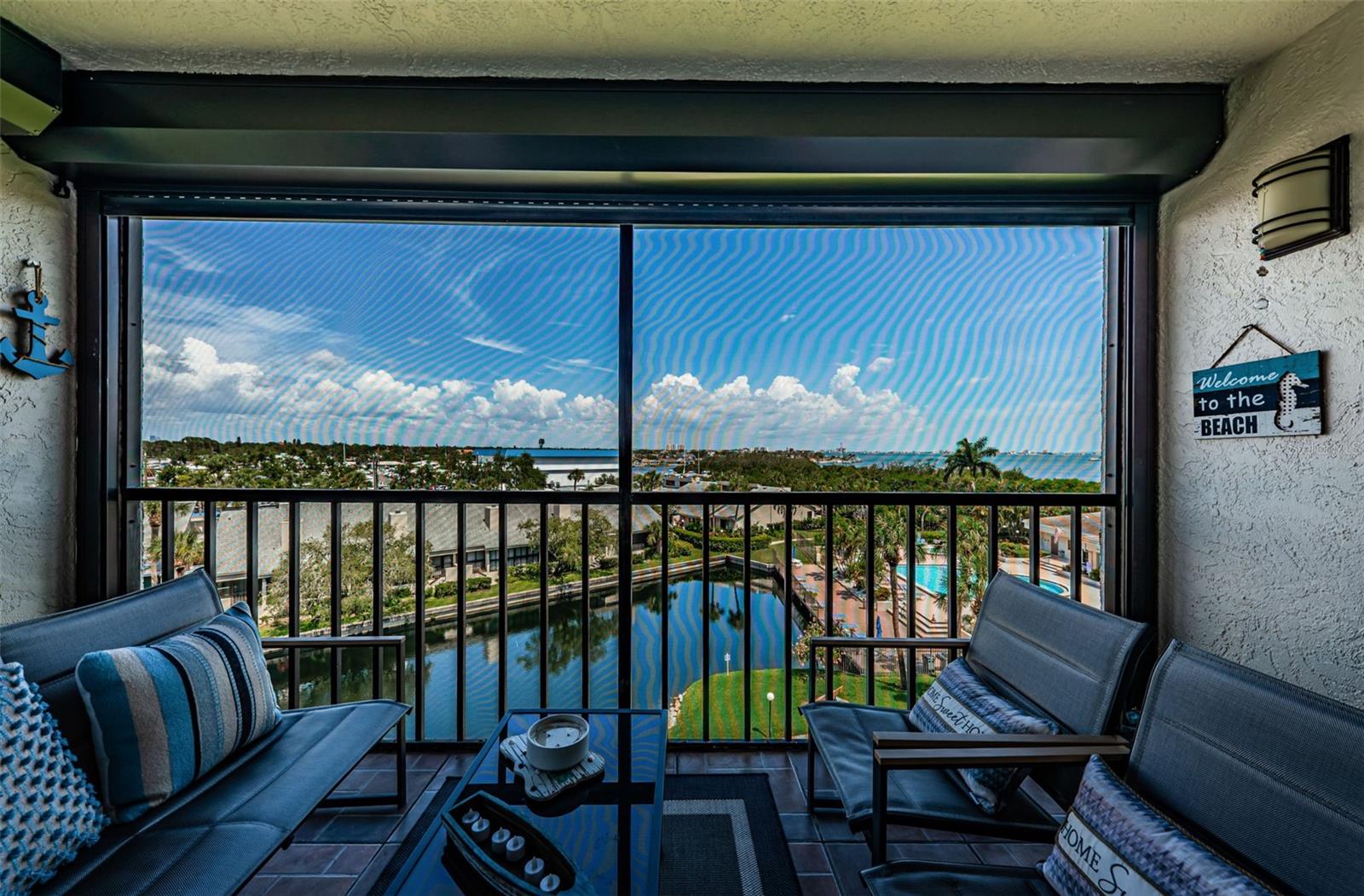 Screened in patio with view of the Bay and Gulf