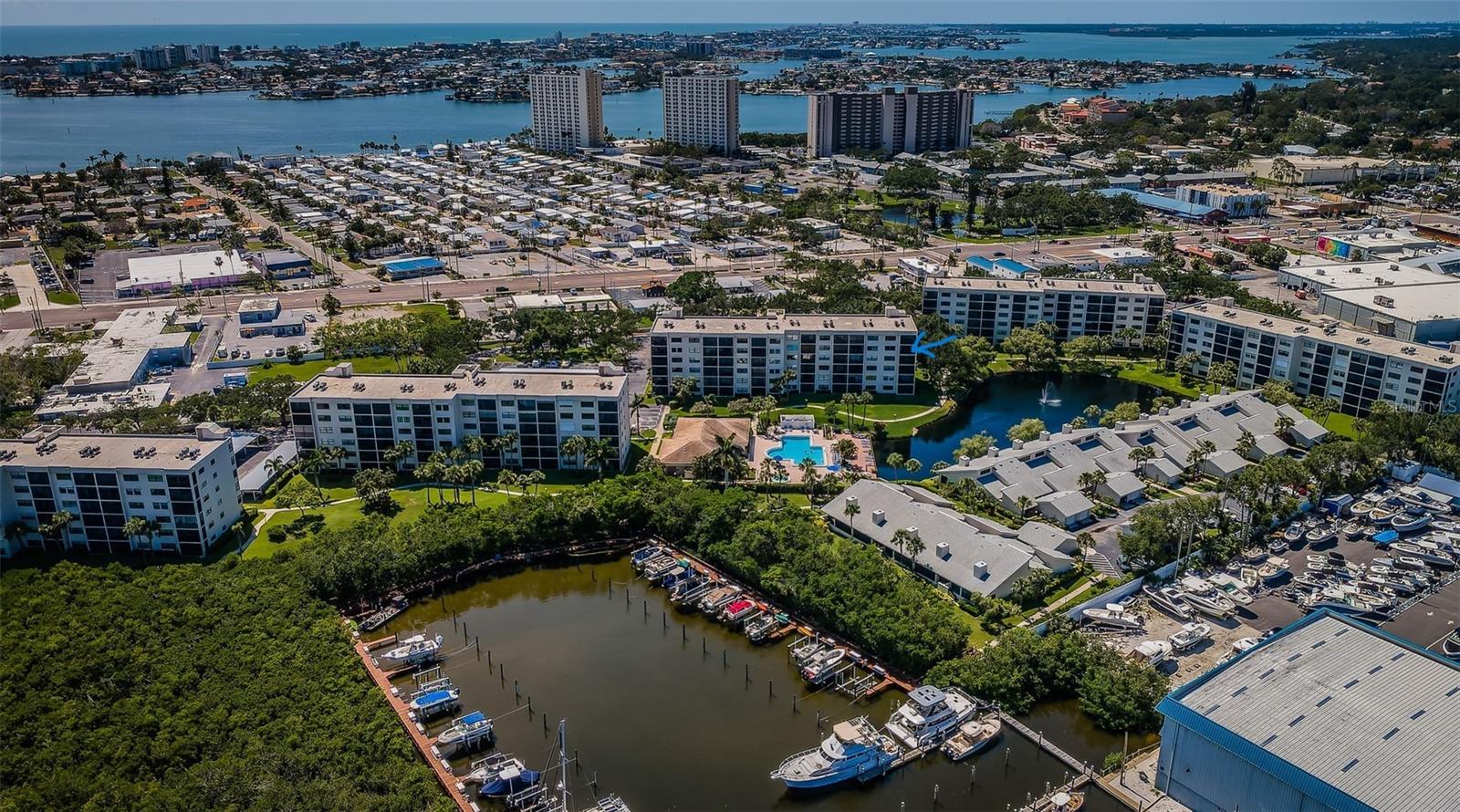 Aerial of bldg with marina next door