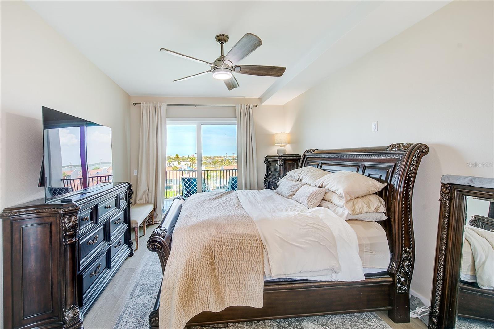 Primary Bedroom Suite with sliders to the balcony.
