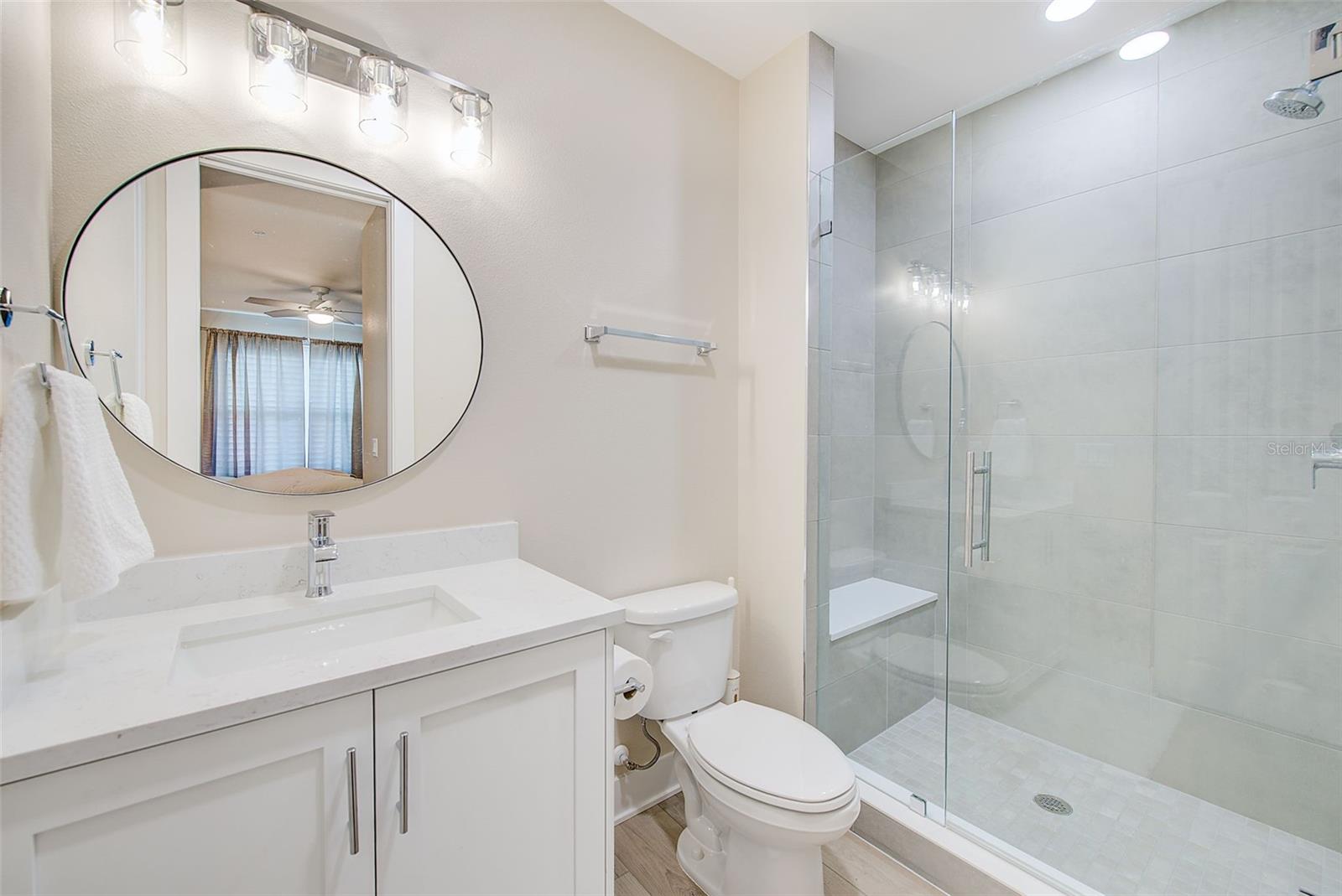 Bathroom 2 with large walk in shower with seat.