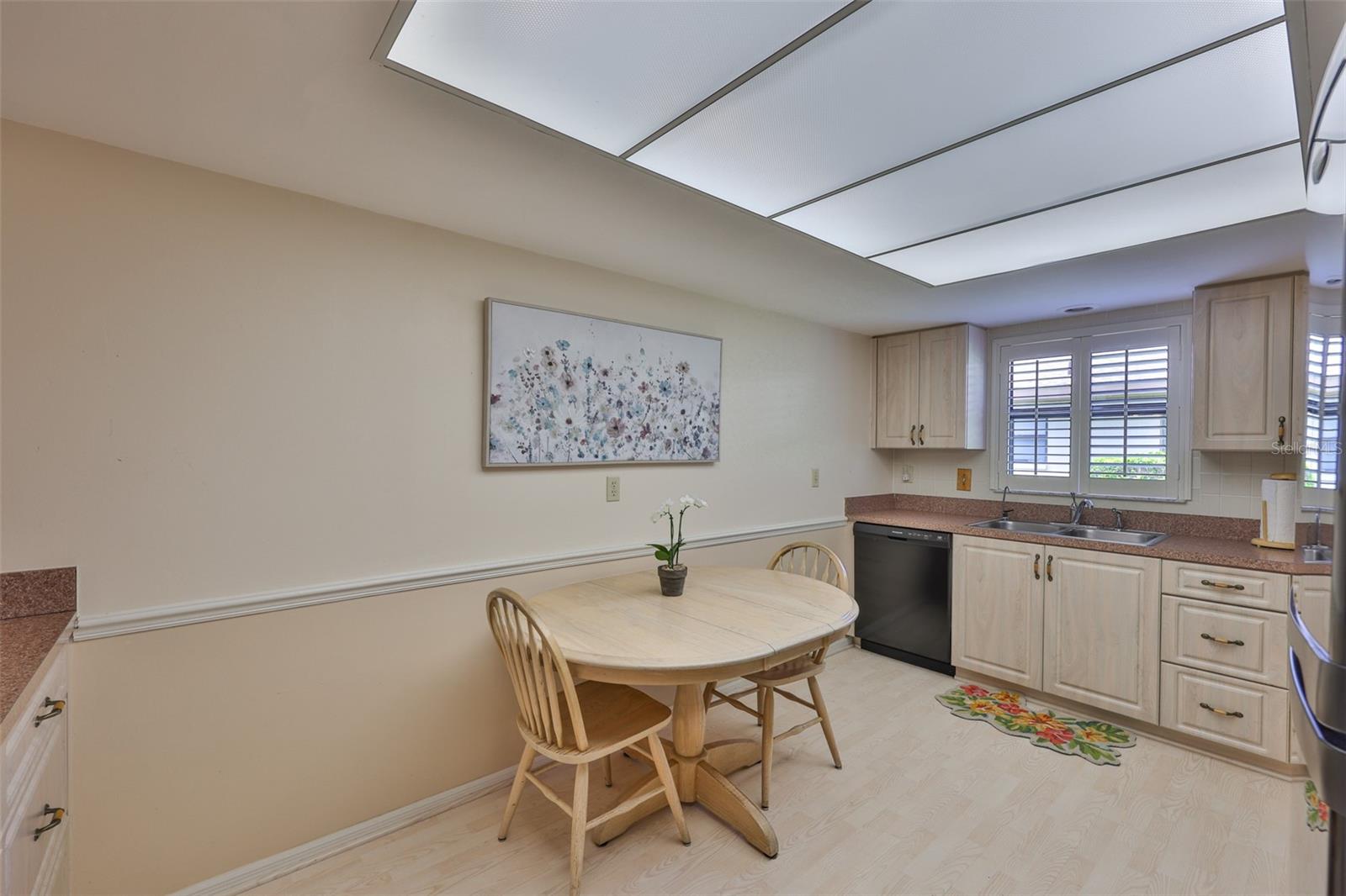 Windows to the outside offer lots of natural Florida sunshine with plantation shutters for privacy.