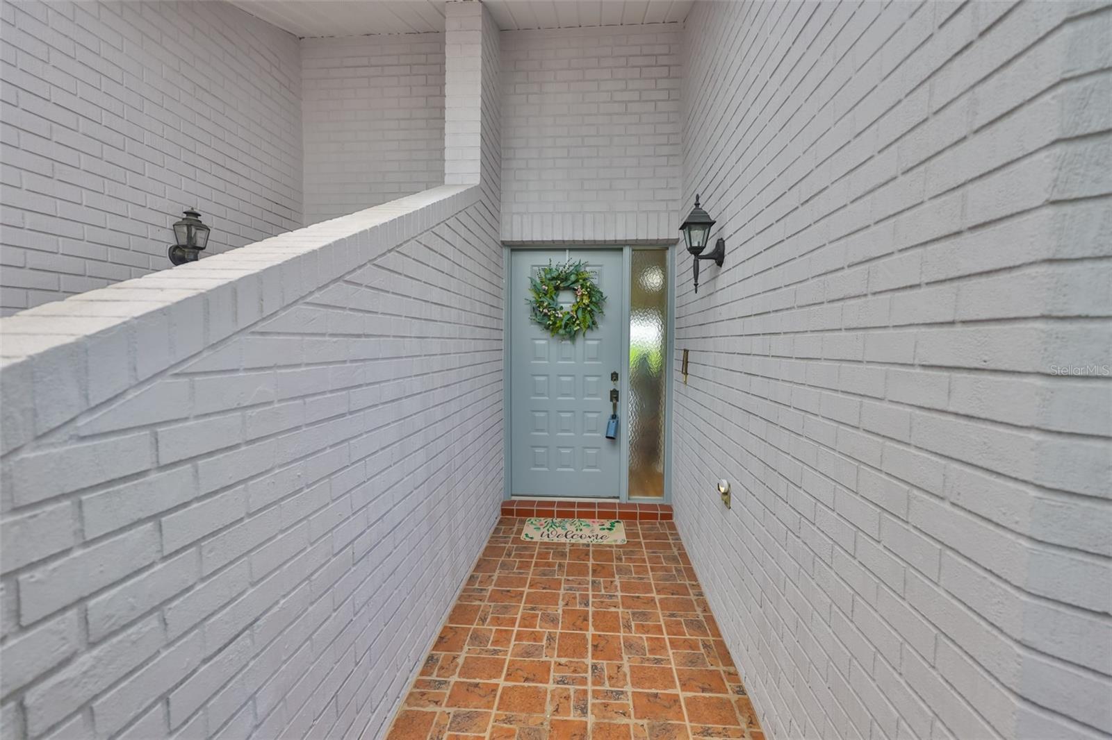 The entrance is covered and protects your guests from the elements.