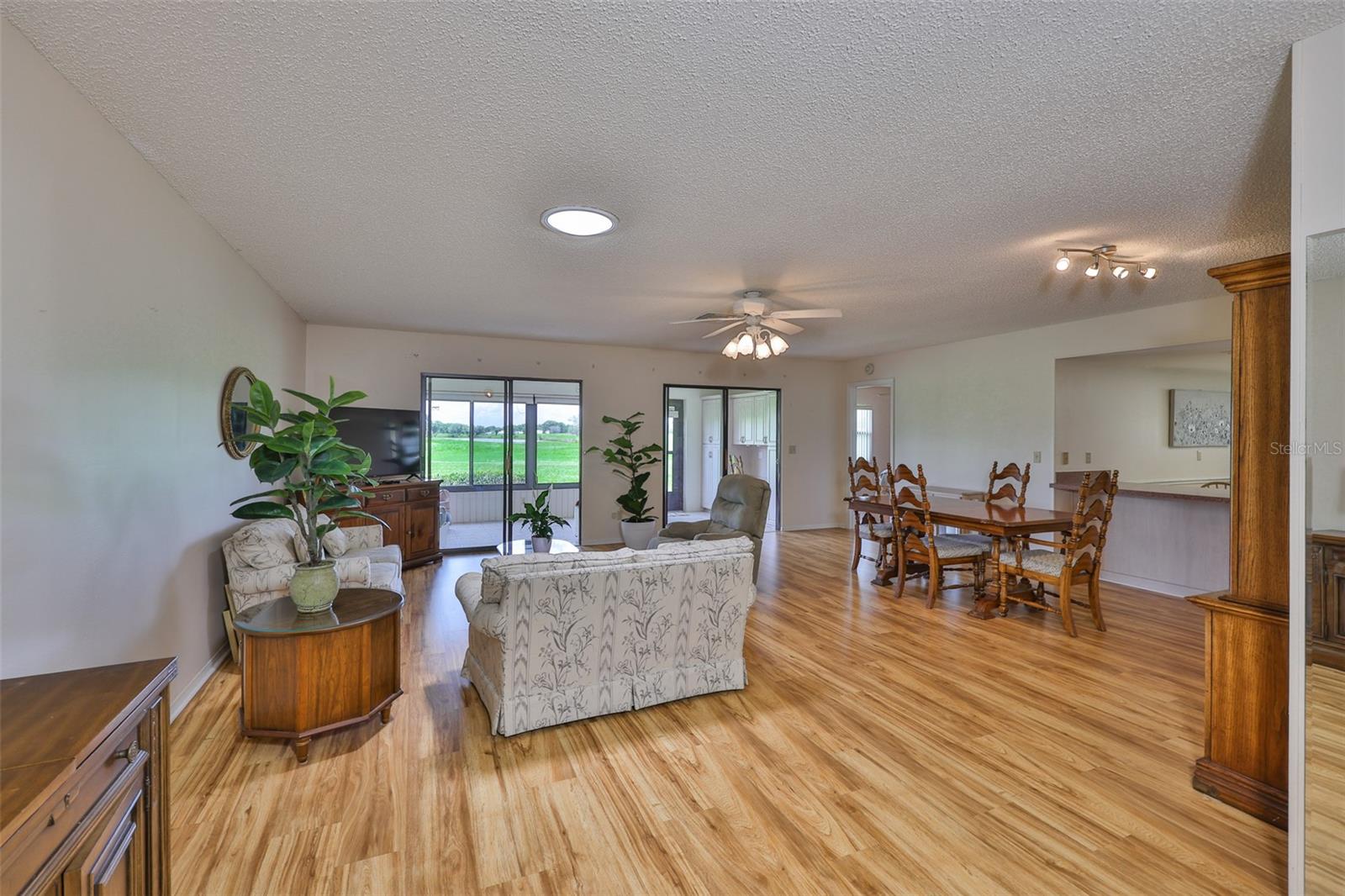 Walking in the front door, you are immediately drawn to the open greenbelt space. Notice the solar tube in the ceiling which allows for a lot of natural light to flow into the home.