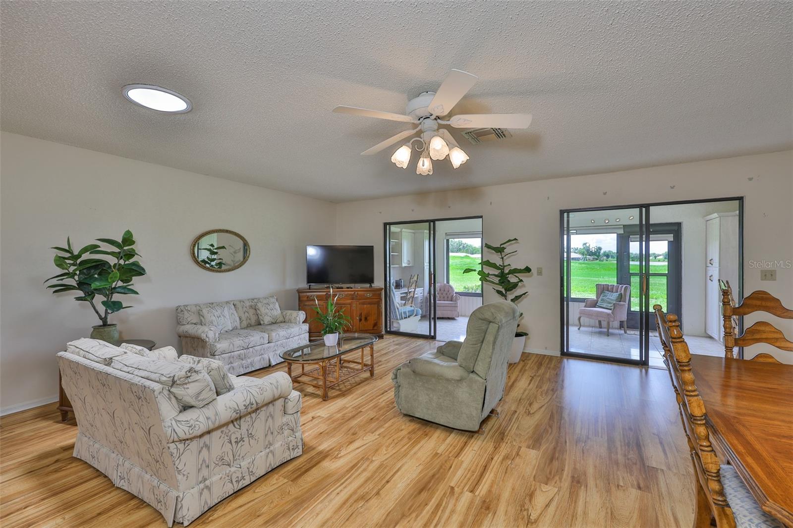 A view of the greenbelt and water are seen from anywhere in the living area and primary bedroom. Remember ALL FURNITURE CONVEYS with the sale of the home.