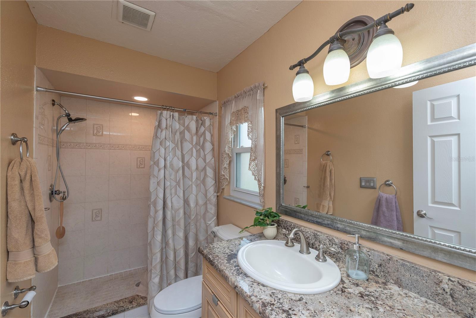 Primary en-suite bath with shower.
