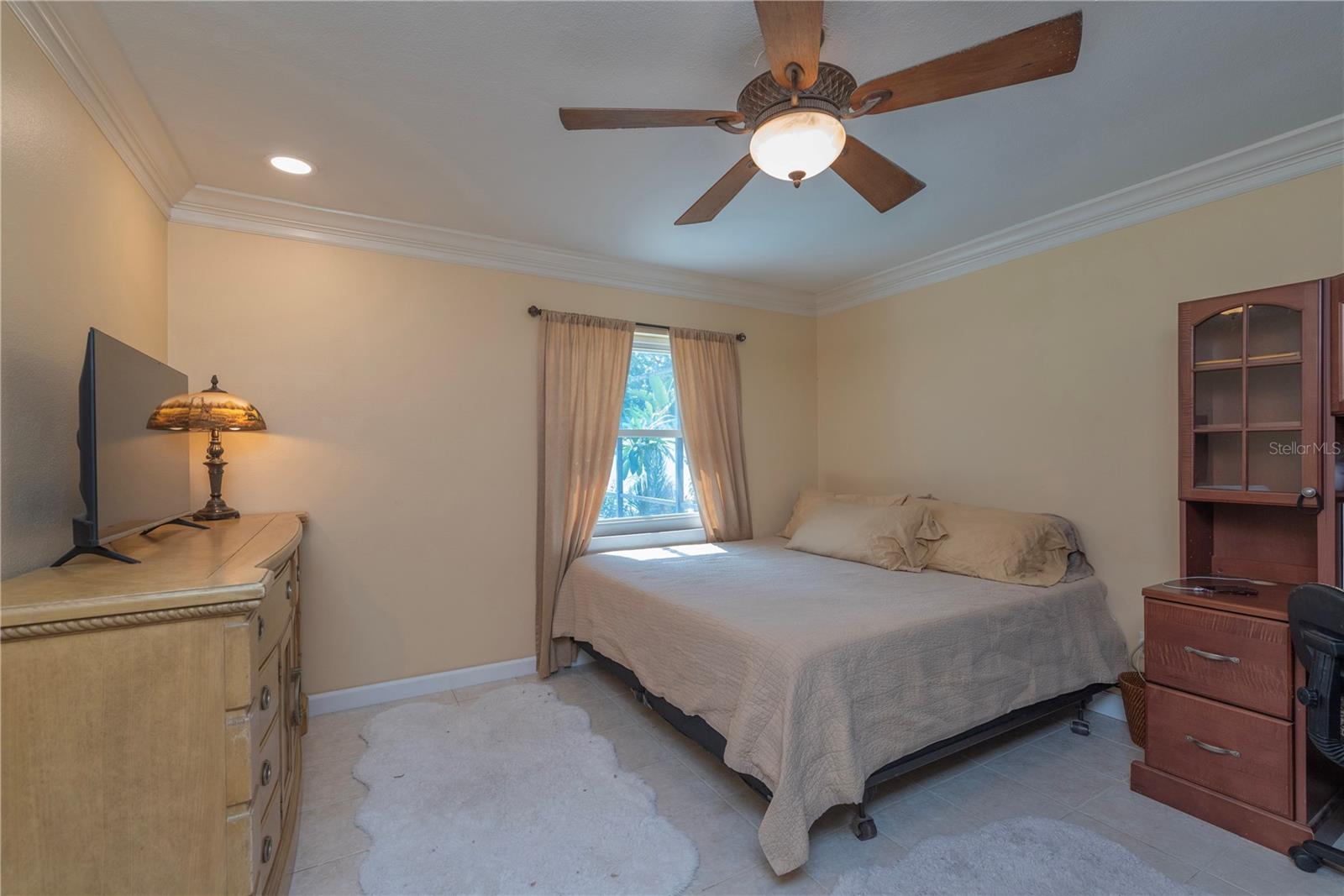 Den being used as a guest room.