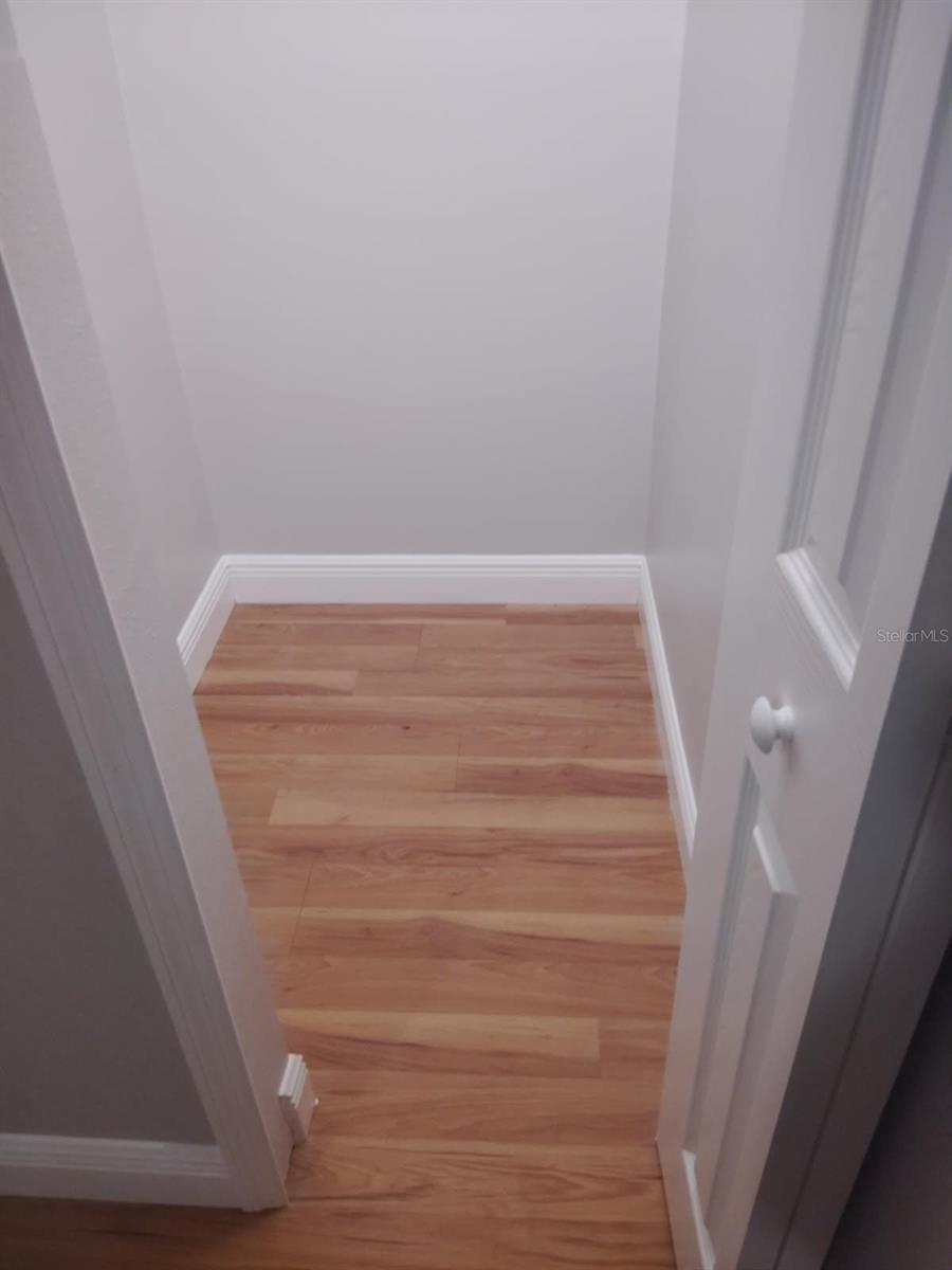 Spacious closet with plenty of storage space.