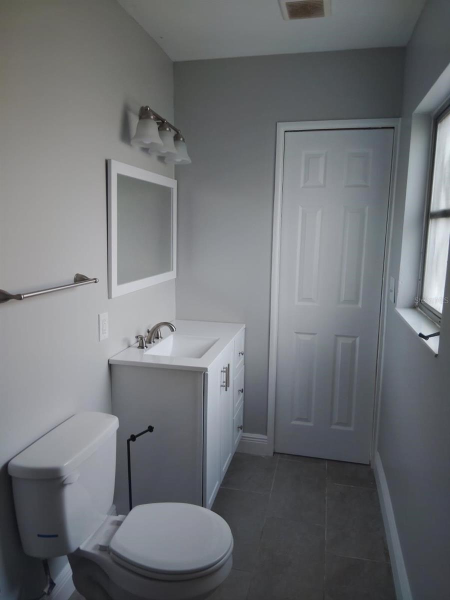 Well-maintained bathroom, with updated modern finishes.