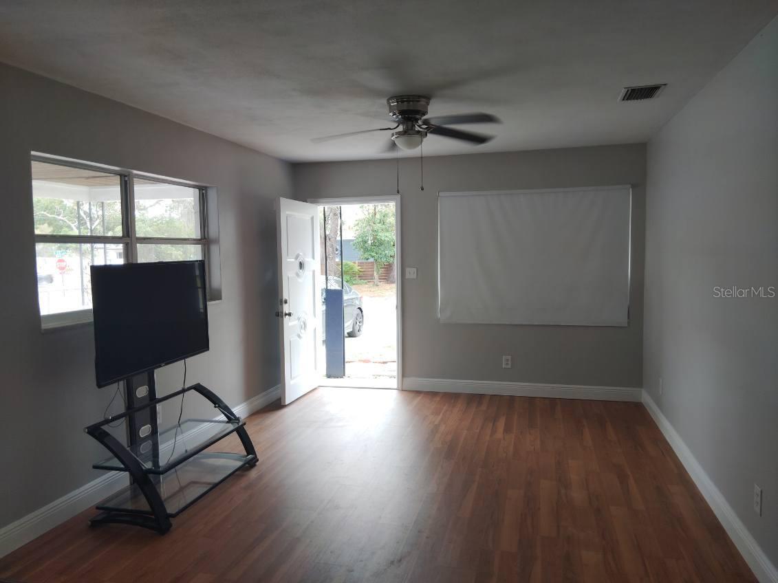 Comfortable Florida room ideal for relaxing or entertaining.
