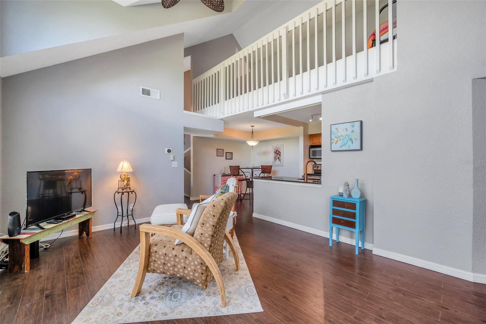 The living room is open to the dining room and kitchen
