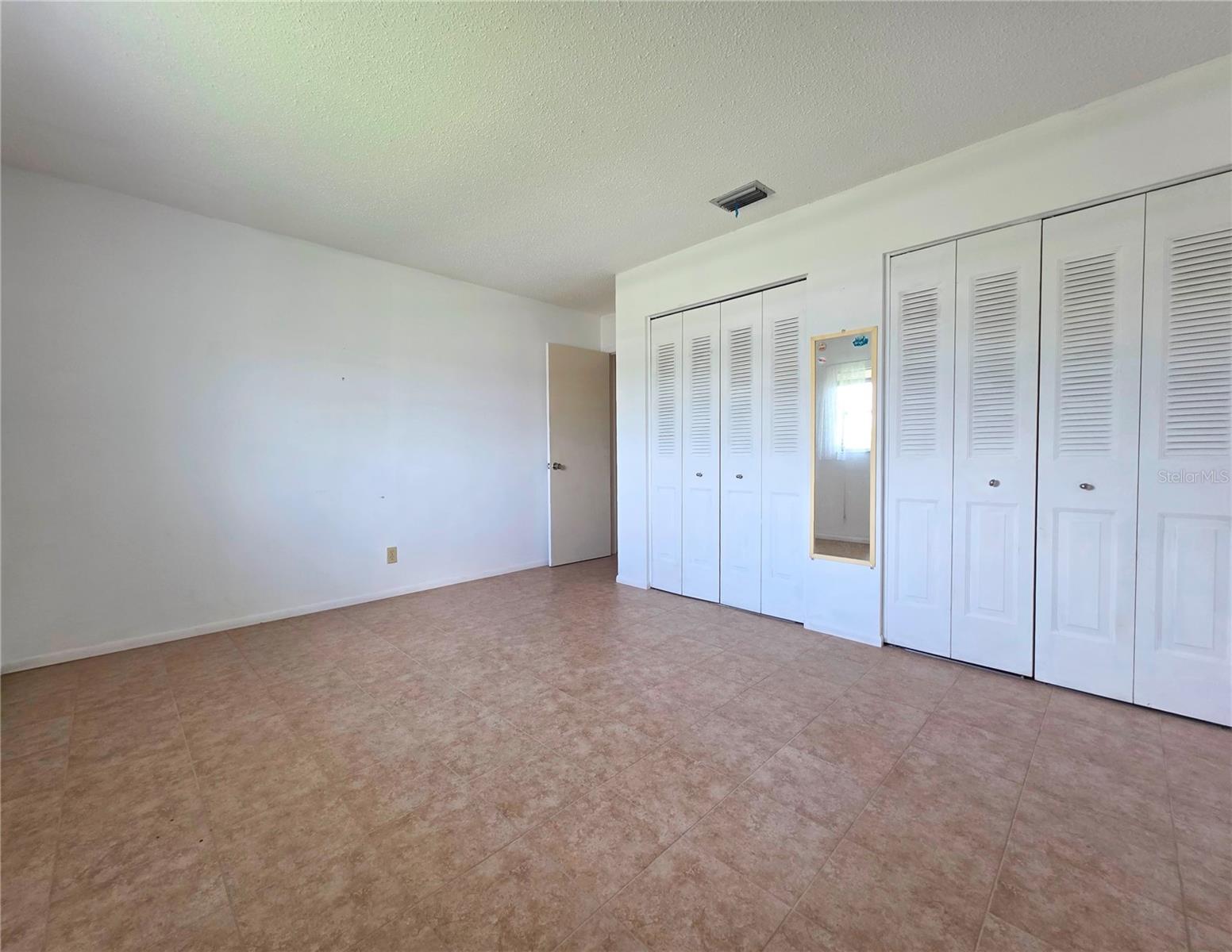 Secondary Bedroom with double closets
