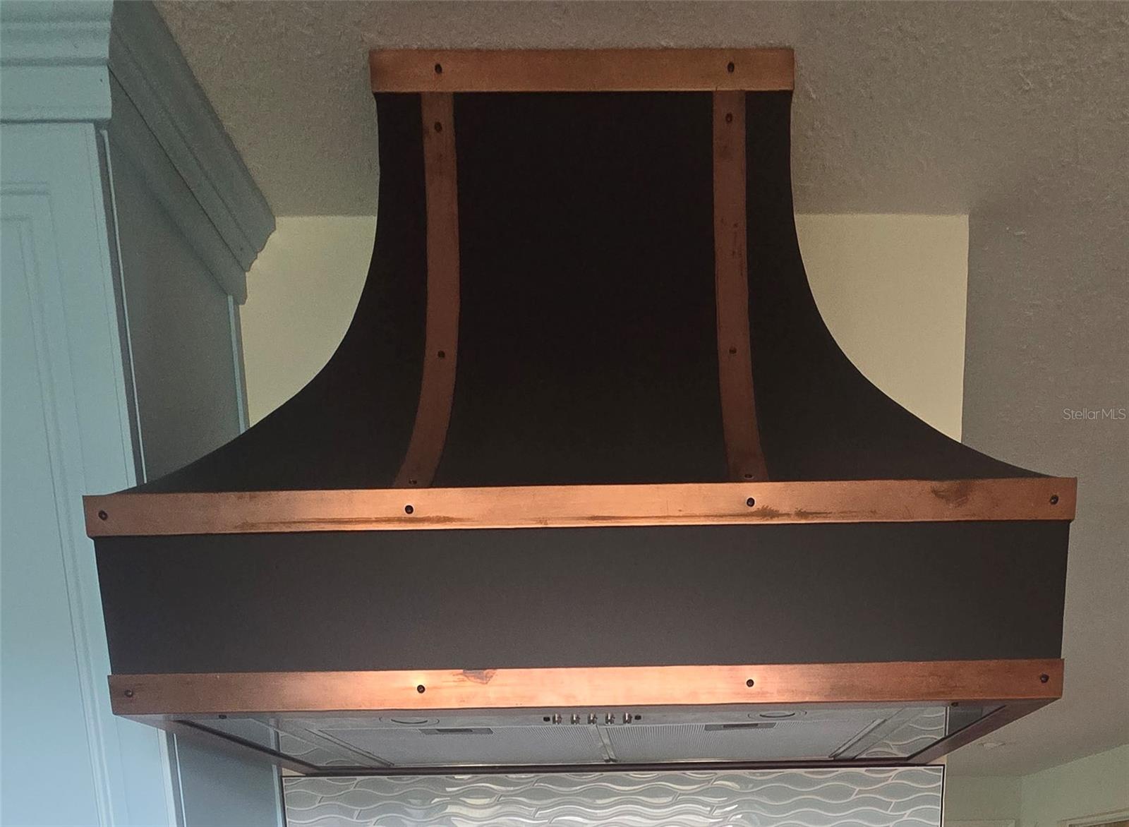Custom built copper stove hood