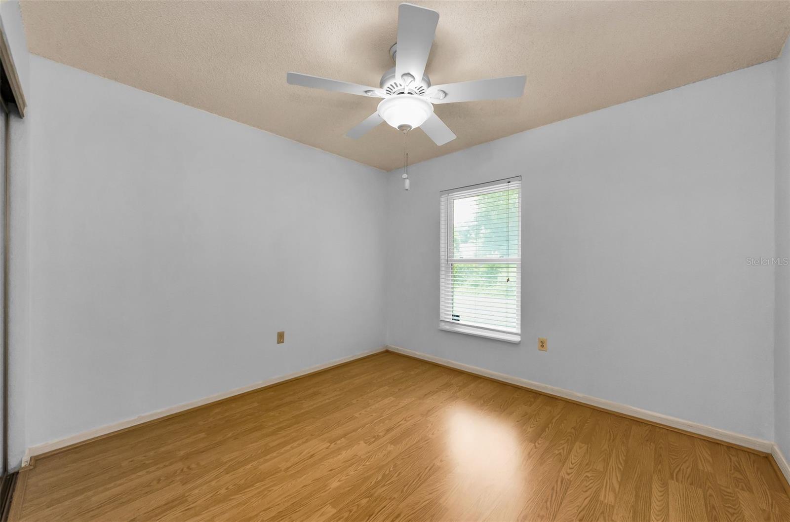The guest bedroom has a window for natural light as well.  Could possibly add a door here and create a back patio - HOA approval needed.