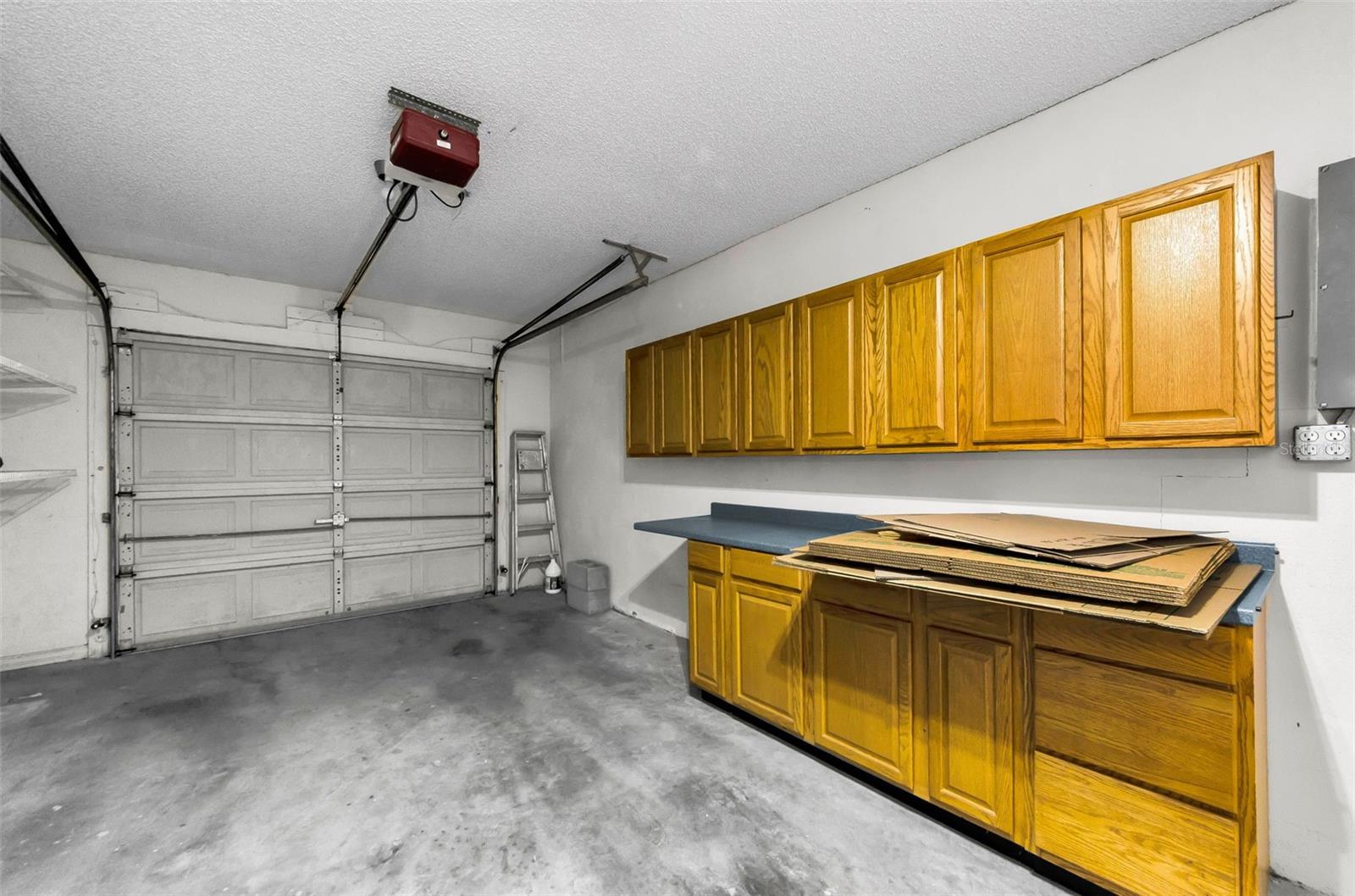 Spacious one car garage with cabinetry.