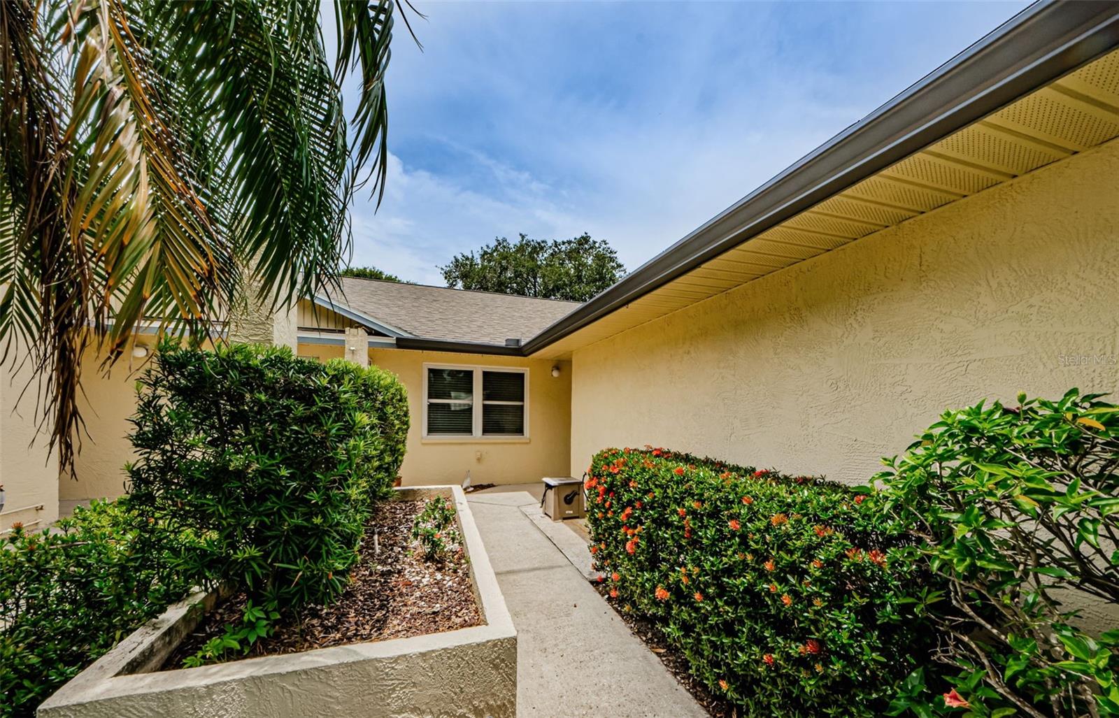 Your private entry way is nicely landscaped.